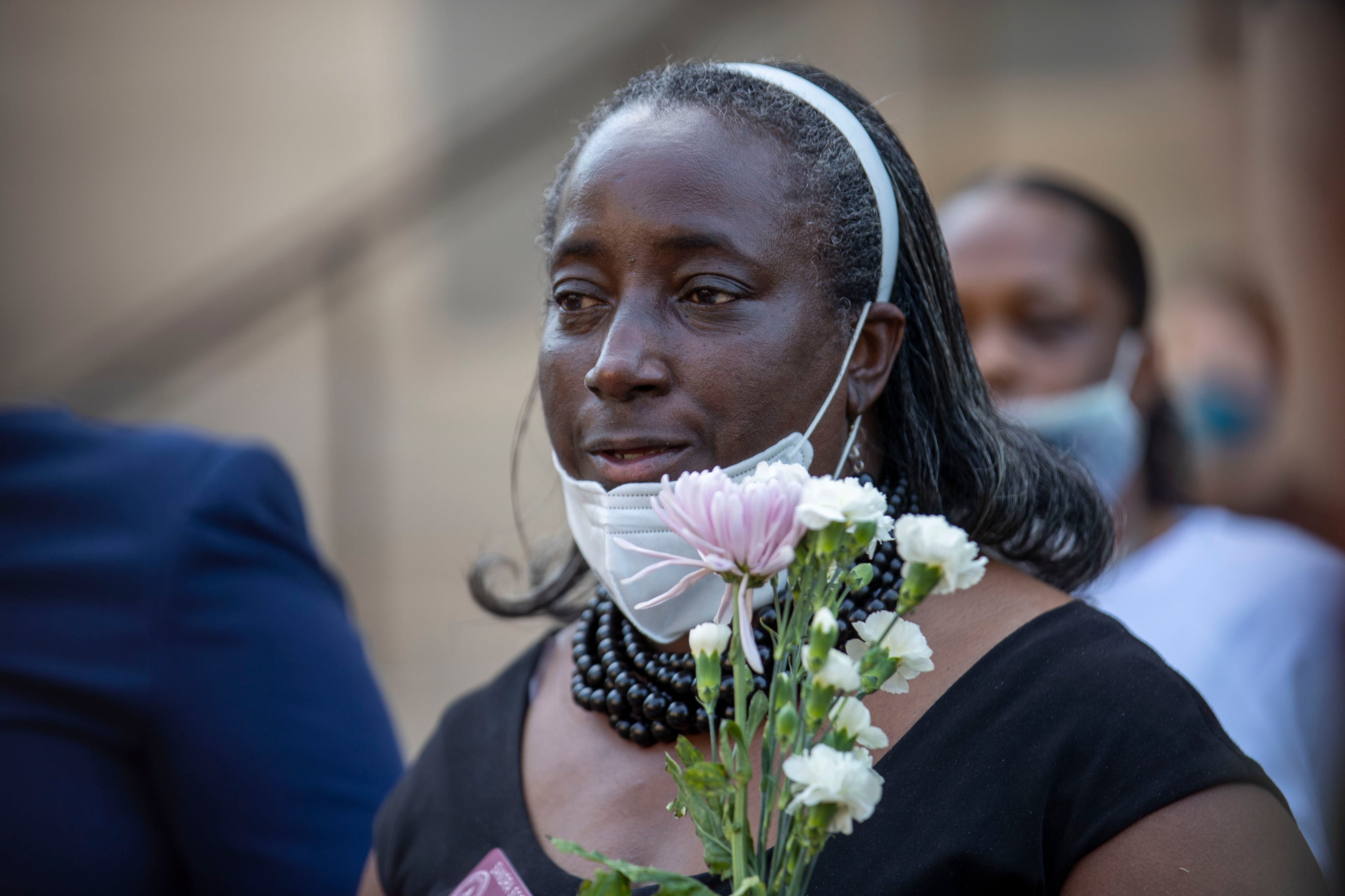 06/02/2020 - Atlanta, Georgia - Georgia Stet Legislator Sandra Scott (D-Rex) holds a bouquet of flowers as she speaks during a press conference on the steps of the Georgia State Capitol Building in Atlanta, Tuesday, June 2, 2020. The press conference was hosted by several local Democratic legislatures who were showing support for mother's who that are seeking justice for the deaths of their sons by police officers. The flowers were for the mothers that spoke during the presser. The legislatures spoke about HB 636 or the Use of Force Data Collection Act. (ALYSSA POINTER / ALYSSA.POINTER@AJC.COM)