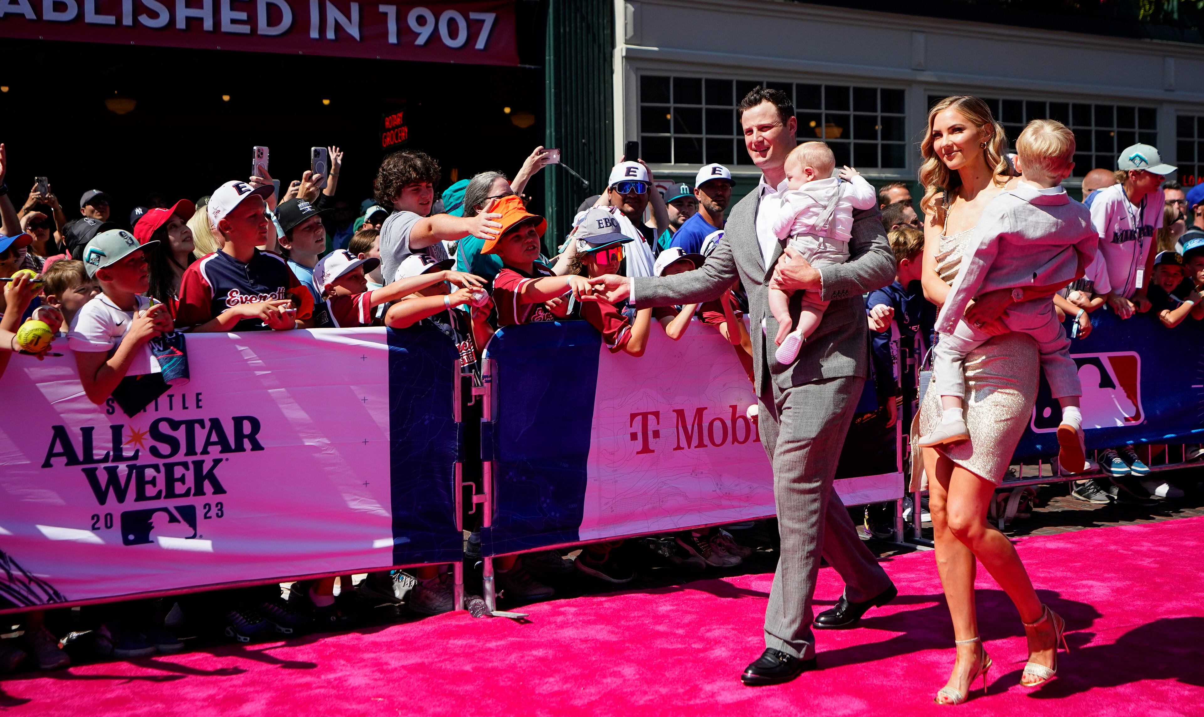 American League starting pitcher Gerrit Cole, of the New York Yankees, walks with his family during the All-Star Game red carpet show, Tuesday, July 11, 2023, in Seattle. (AP Photo/Lindsey Wasson)