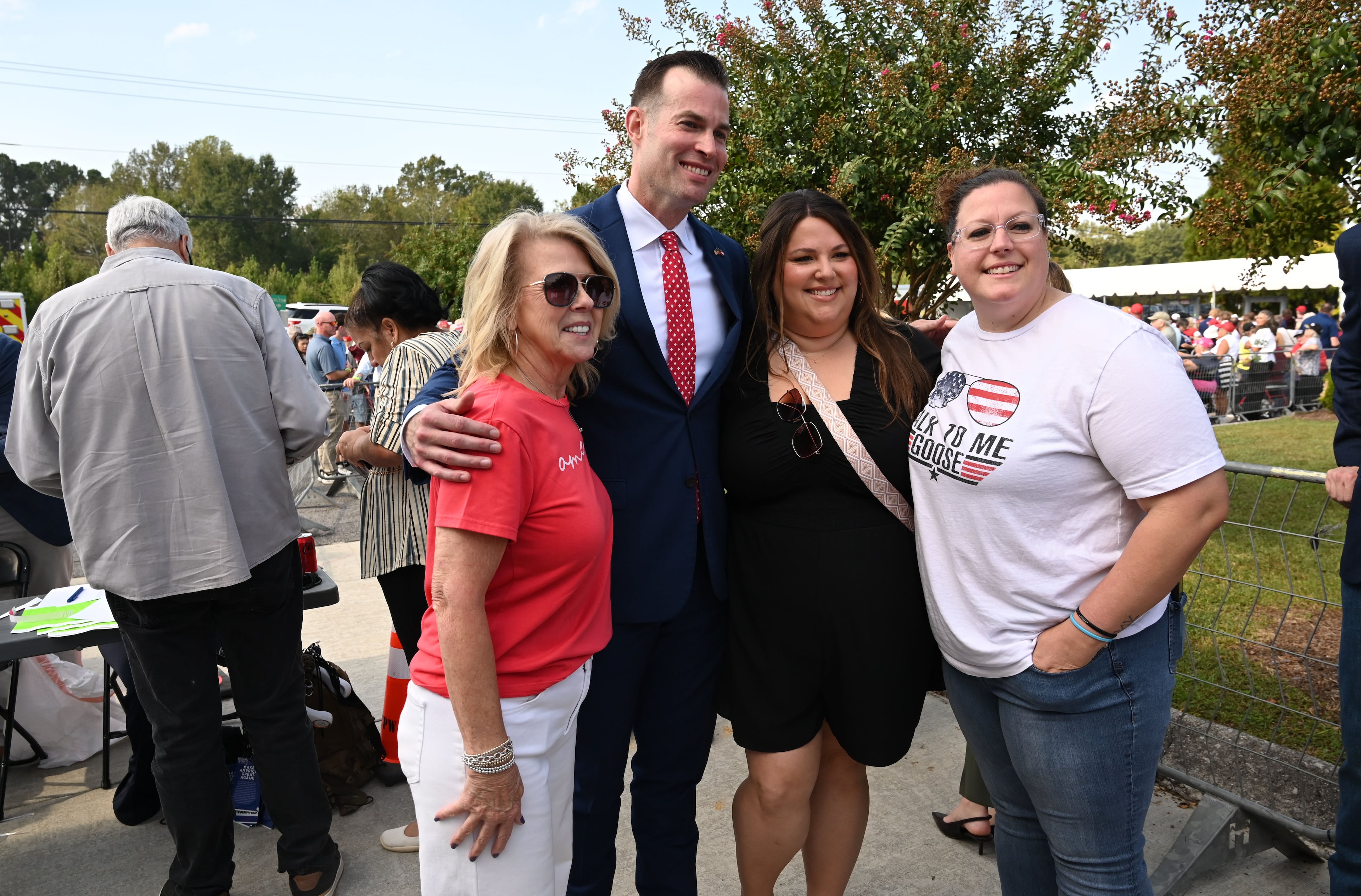 U.S. Rep. Clay Fuller, second from left, poses with supporters before a campaign rally at Dalton Municipal Airport on Friday, Oct. 16, 2026, in Dalton. (Hyosub Shin/AJC)