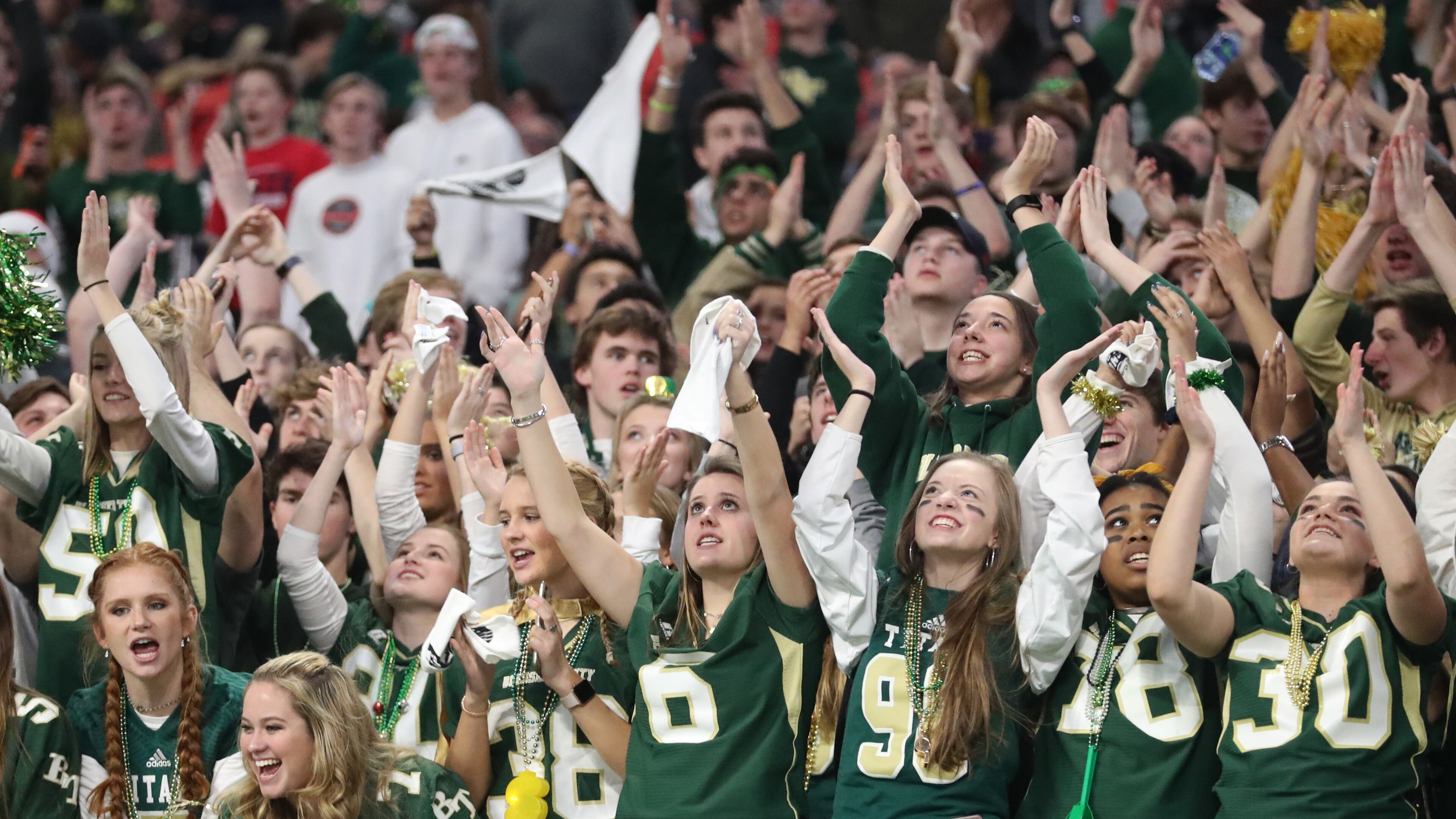 Blessed Trinity students cheer in the fourth quarter of their game against Cartersville in the Class AAAA State Championship at Mercedes-Benz Stadium Wednesday, December 12, 2018, in Atlanta. Blessed Trinity won 23-9. (JASON GETZ/SPECIAL TO THE AJC)