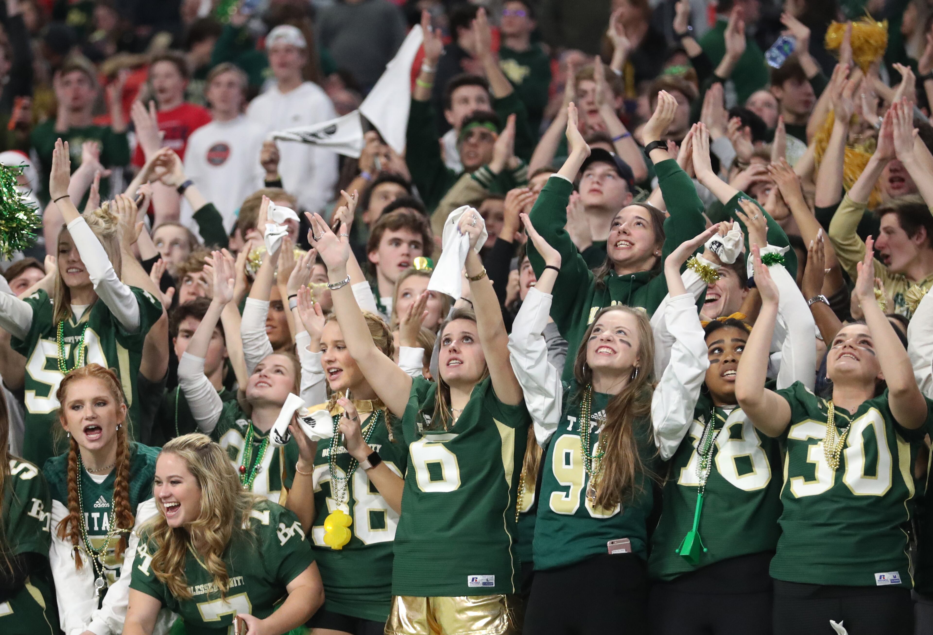 Blessed Trinity students cheer in the fourth quarter of their game against Cartersville in the Class AAAA State Championship at Mercedes-Benz Stadium Wednesday, December 12, 2018, in Atlanta. Blessed Trinity won 23-9. (JASON GETZ/SPECIAL TO THE AJC)