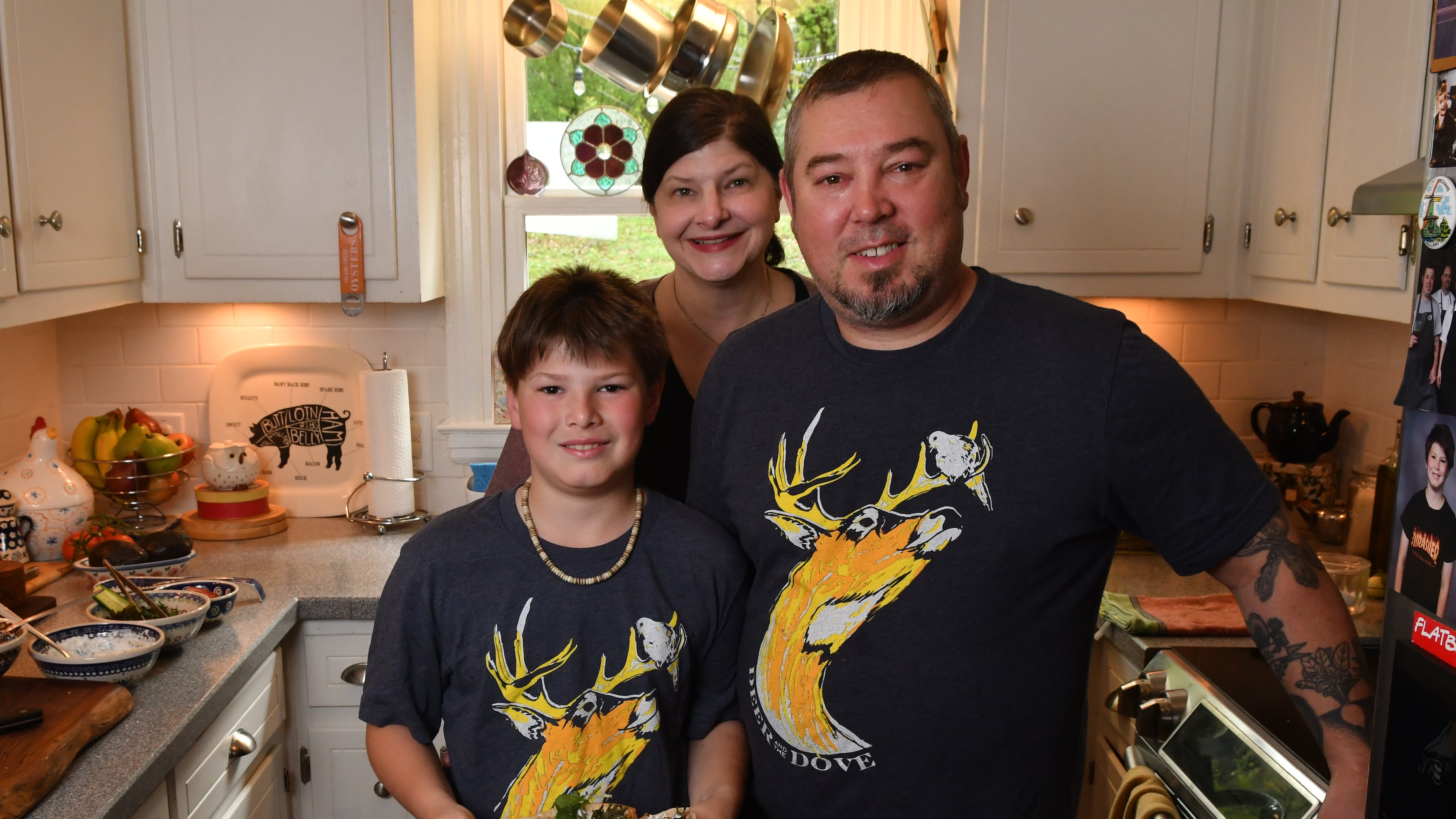 230327 Decatur, Ga: Chef Terry Koval, owner and executive chef at The Deer and The Dove restaurant in Decatur, with his family, Jenn Koval (spouse and also owner and GM of The Deer and The Dove) and son Jackson (10) photographed in their home and shown with with one of TerryÕs favorite go-to meals he cooks for the family, Lamb Pita with Cucumber Sauce. For At Home series AAJC040623ATHOMETERRYKOVAL Food styling by Terry Koval (CHRIS HUNT FOR THE ATLANTA JOURNAL-CONSTITUTION)