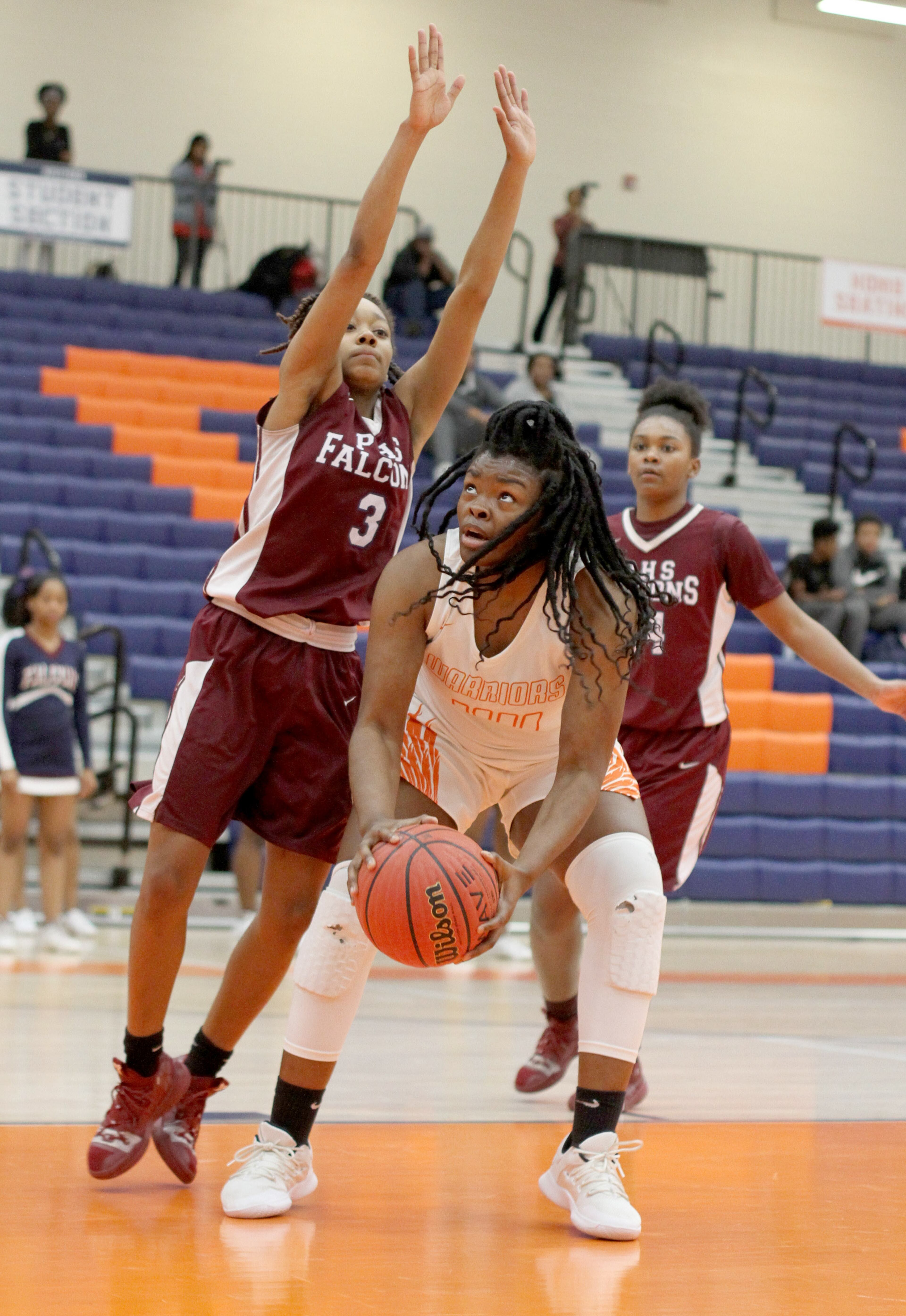 North Cobb High School player Shaybryana Simpson looks to the basket while being guarded by Pebblebrook High School player Meliyah White (L) during the first round of the girls' high school basketball tournament at North Cobb High School in Kennesaw February 15, 2019. STEVE SCHAEFER / SPECIAL TO THE AJC