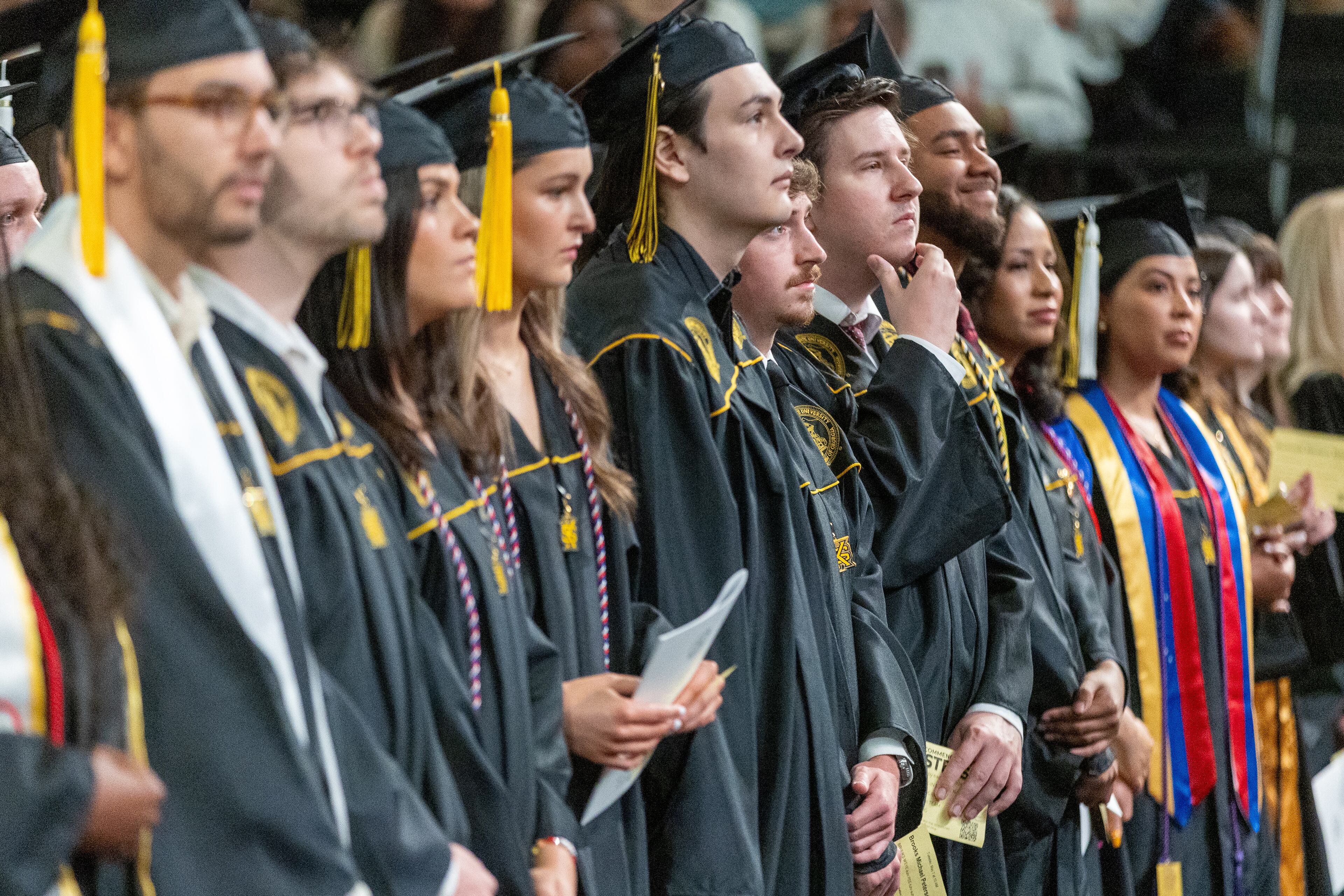 Graduates lined up before the start of their graduation at Kennesaw State University on Tuesday, May 7, 2014. (Steve Schaefer / AJC)
