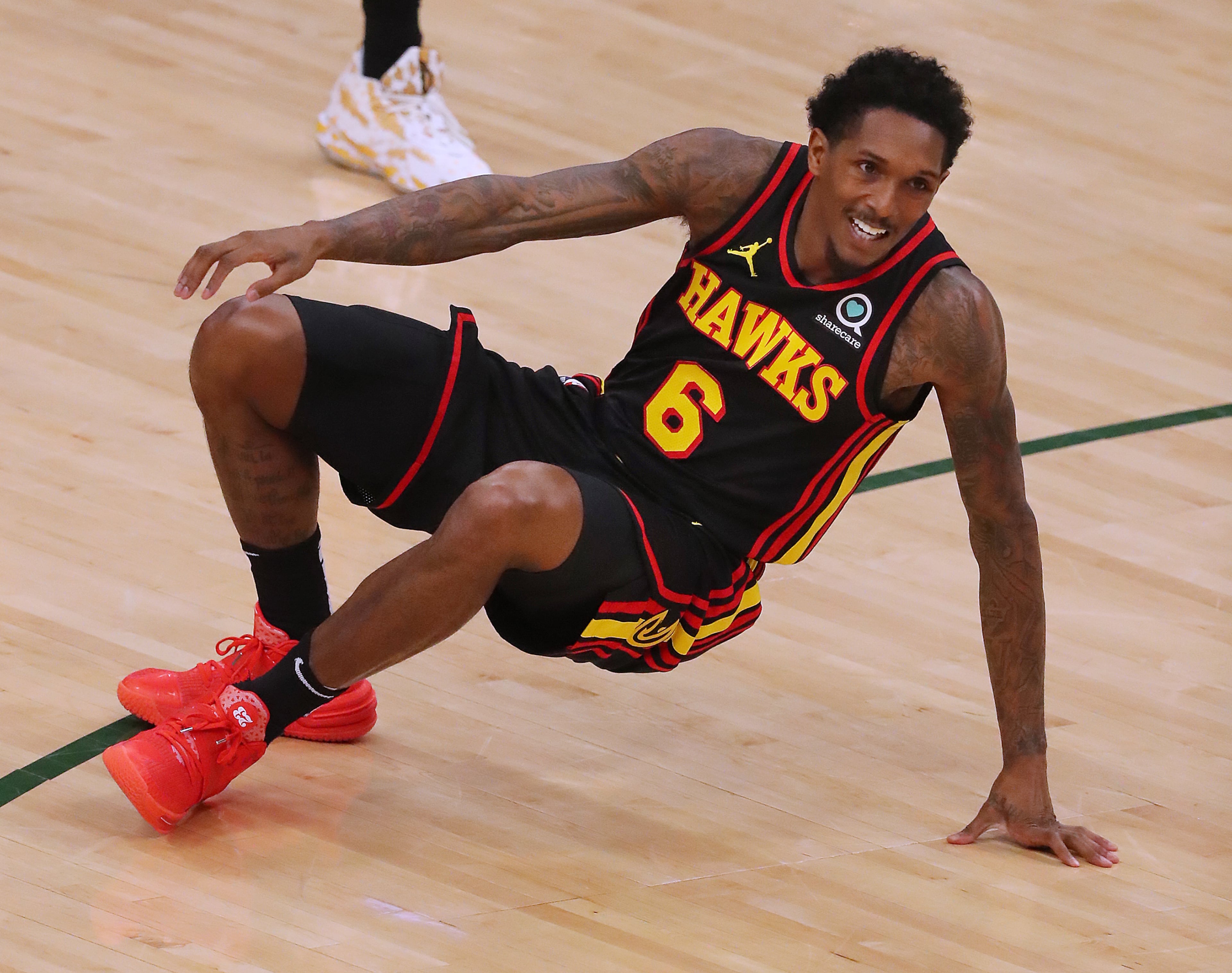 Hawks guard Lou Williams is knocked to the hardwood. “Curtis Compton / Curtis.Compton@ajc.com”