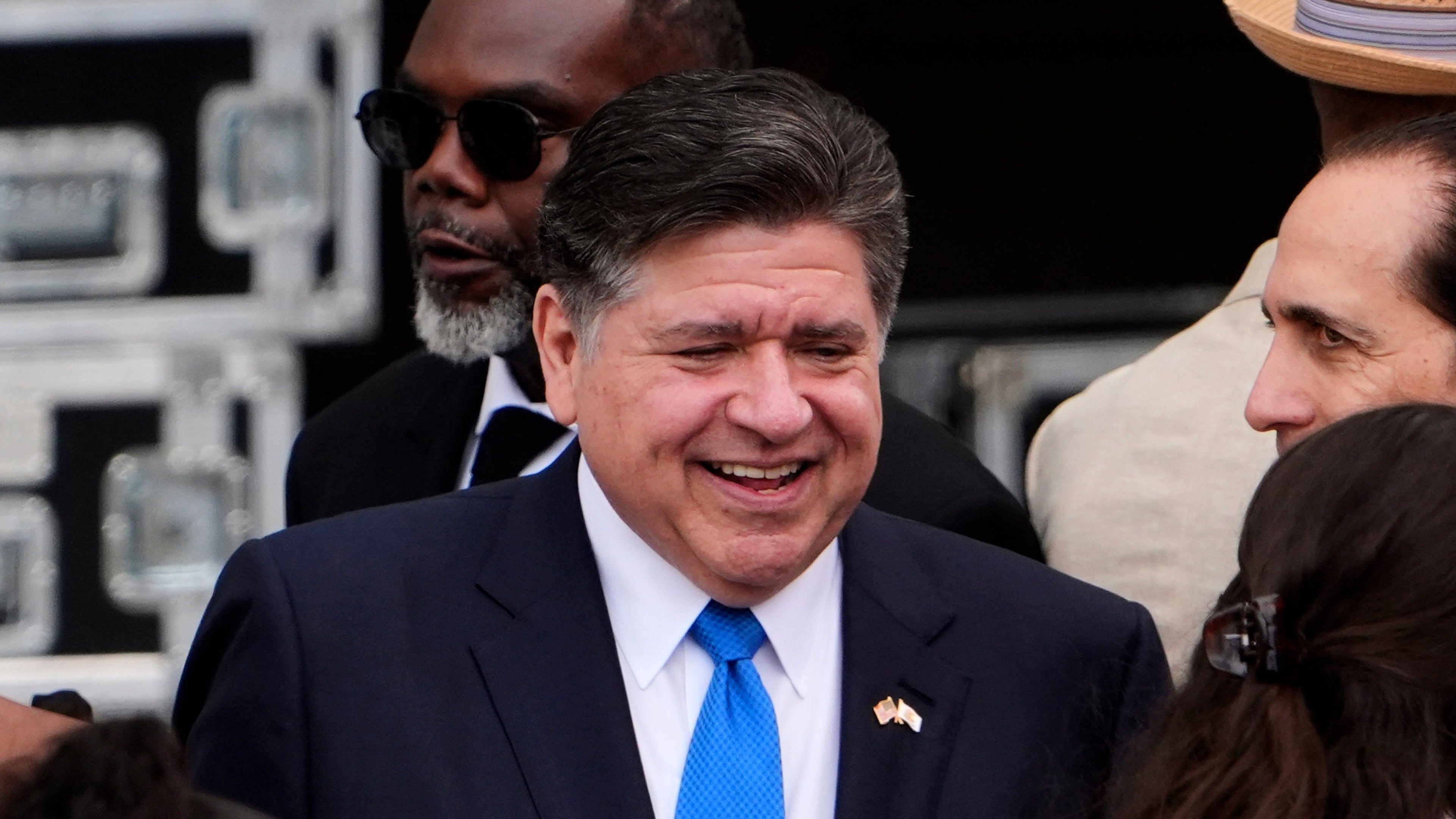 FILE - Illinois Gov. JB Pritzker, center, mingles ahead of the Obama Presidential Center dedication ceremony Thursday, June 18, 2026, in Chicago. (AP Photo/Jeff Roberson,File)