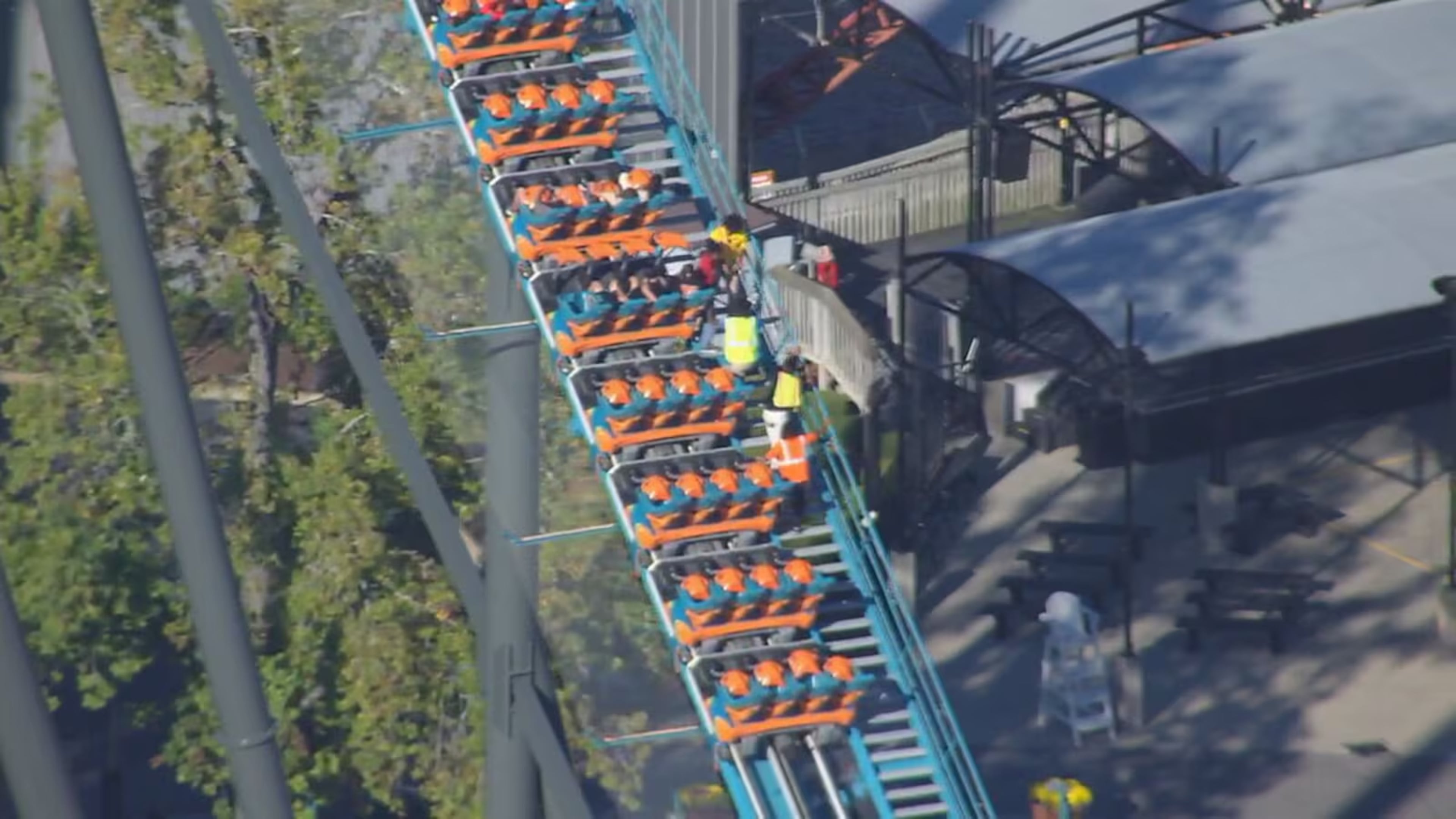 Riders on the Goliath roller coaster at Six Flags over Georgia in Austell are evacuated by park personnel on Monday, Oct. 12, 2026. One person died and several others were injured, Cobb County Police said Monday evening. (Courtesy WSB-TV)