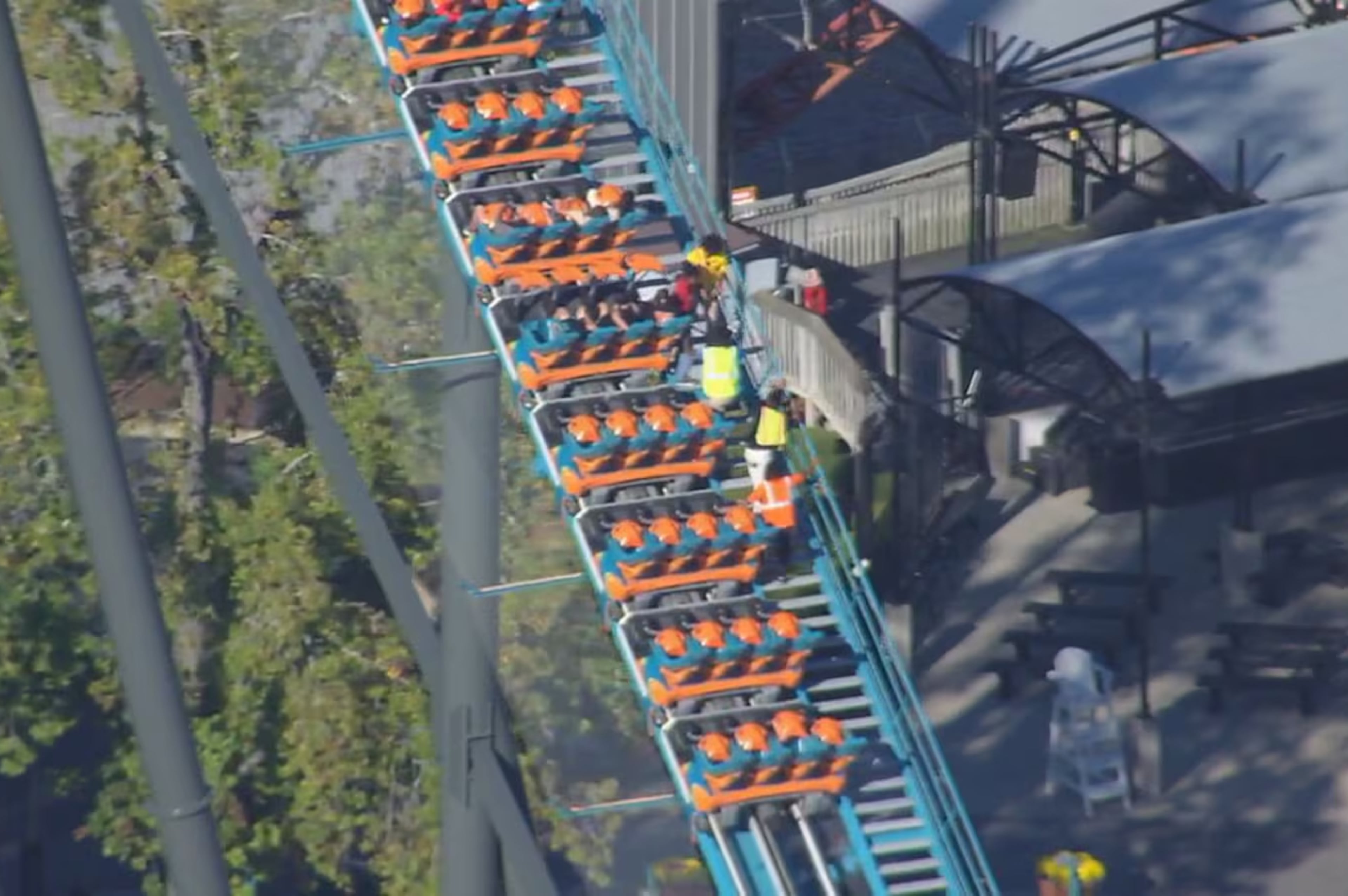 Riders on the Goliath roller coaster at Six Flags over Georgia in Austell are evacuated by park personnel on Monday, Oct. 12, 2026. One person died and several others were injured, Cobb County Police said Monday evening. (Courtesy WSB-TV)