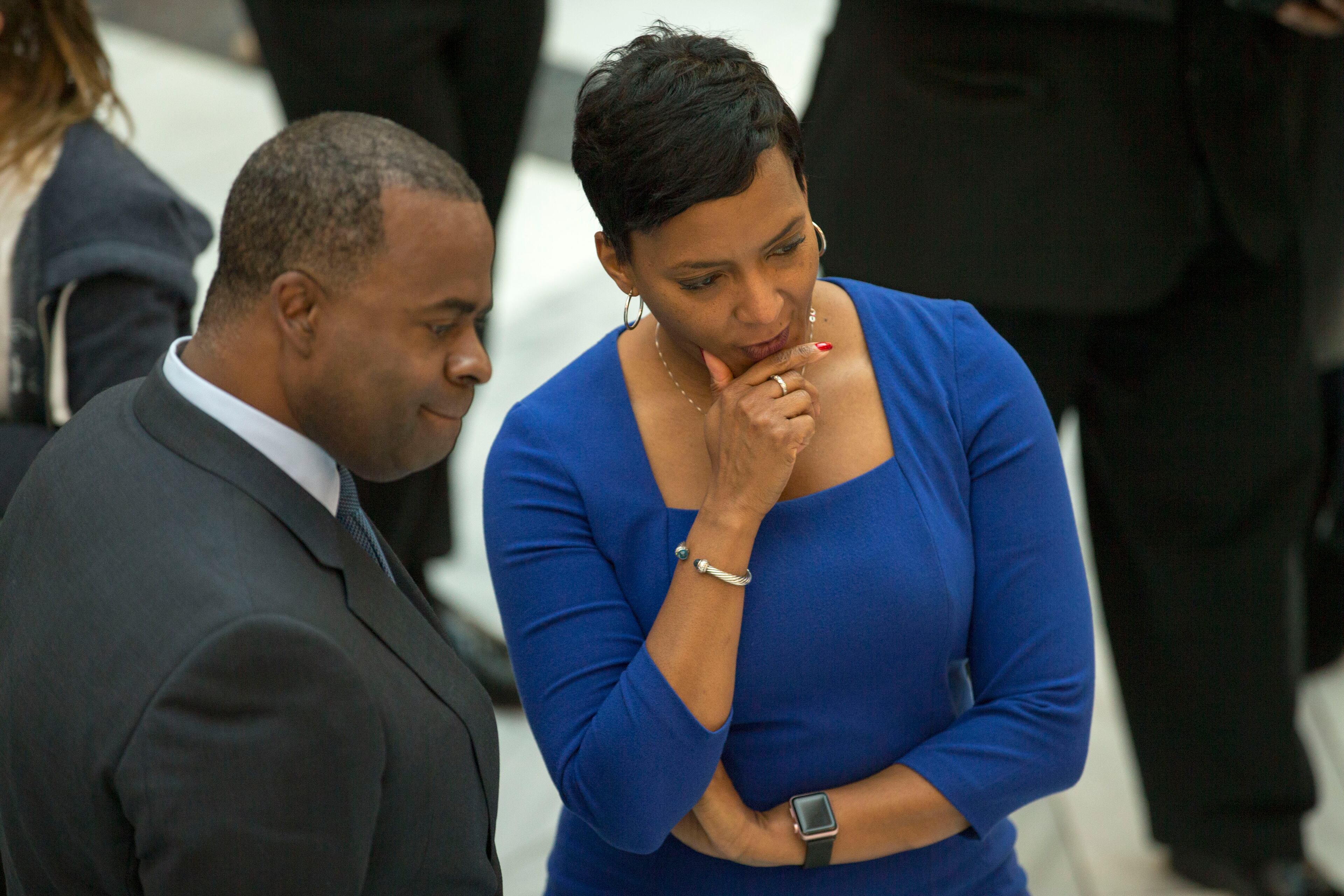 Atlanta Mayor Kasim Reed and Mayor-elect Keisha Lance Bottoms have a conversation during Reed's final workday at Atlanta City Hall on Friday, Dec. 29, 2017.