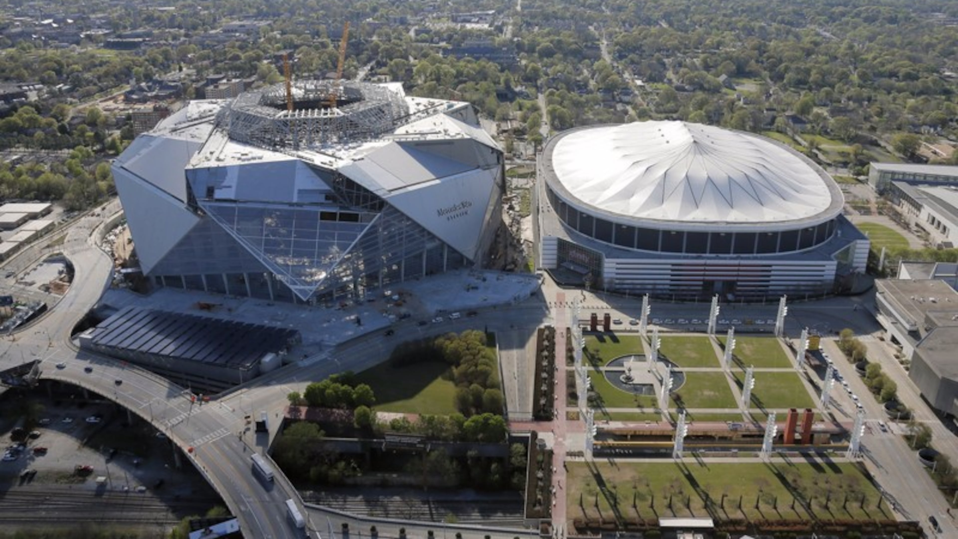 Traffic planning for the new Mercedes-Benz Stadium borrows successful ideas from other arenas and creates new ones unique to the venue. AJC file photo
