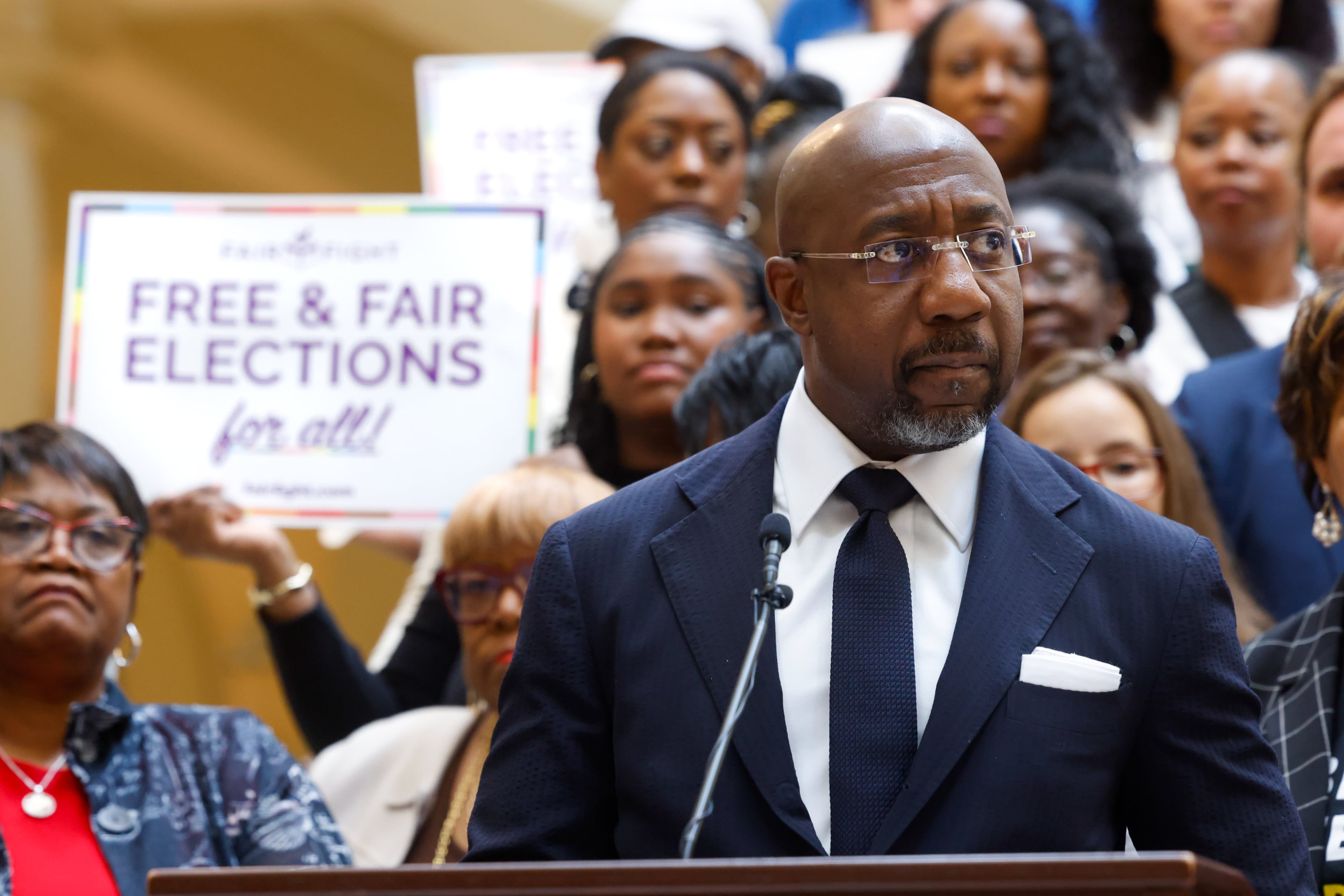 Democratic U.S. Sen. Raphael Warnock speaks at a press conference before the state legislature convenes for a special session in Atlanta on June 17, 2026. Georgia Republican leaders later announced that they wouldn’t redraw the state’s political maps during the session. (Arvin Temkar/AJC)