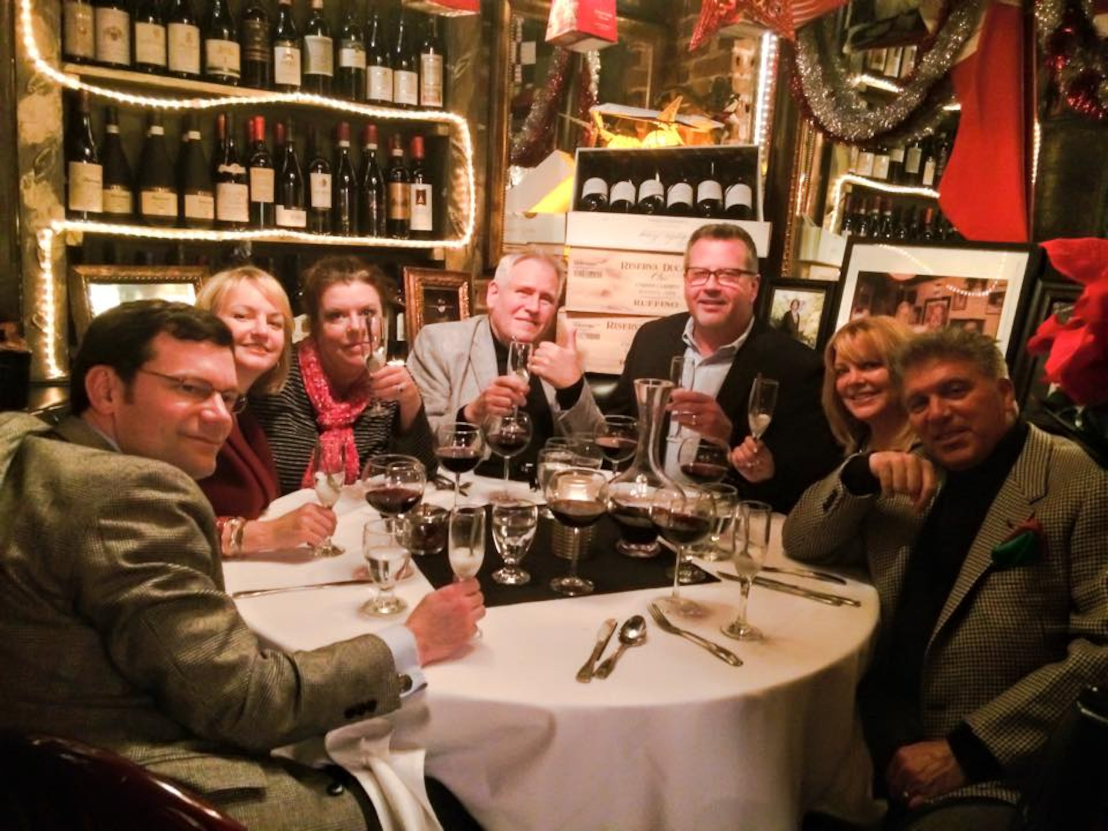 This was our Christmas Eve last year. We had dinner with our friends Mike & Vikki, on the far right, Will & Kerby, in the center, and Lynn-Anne, in between my husband Charlie and me. But alas, no one brought puppies.