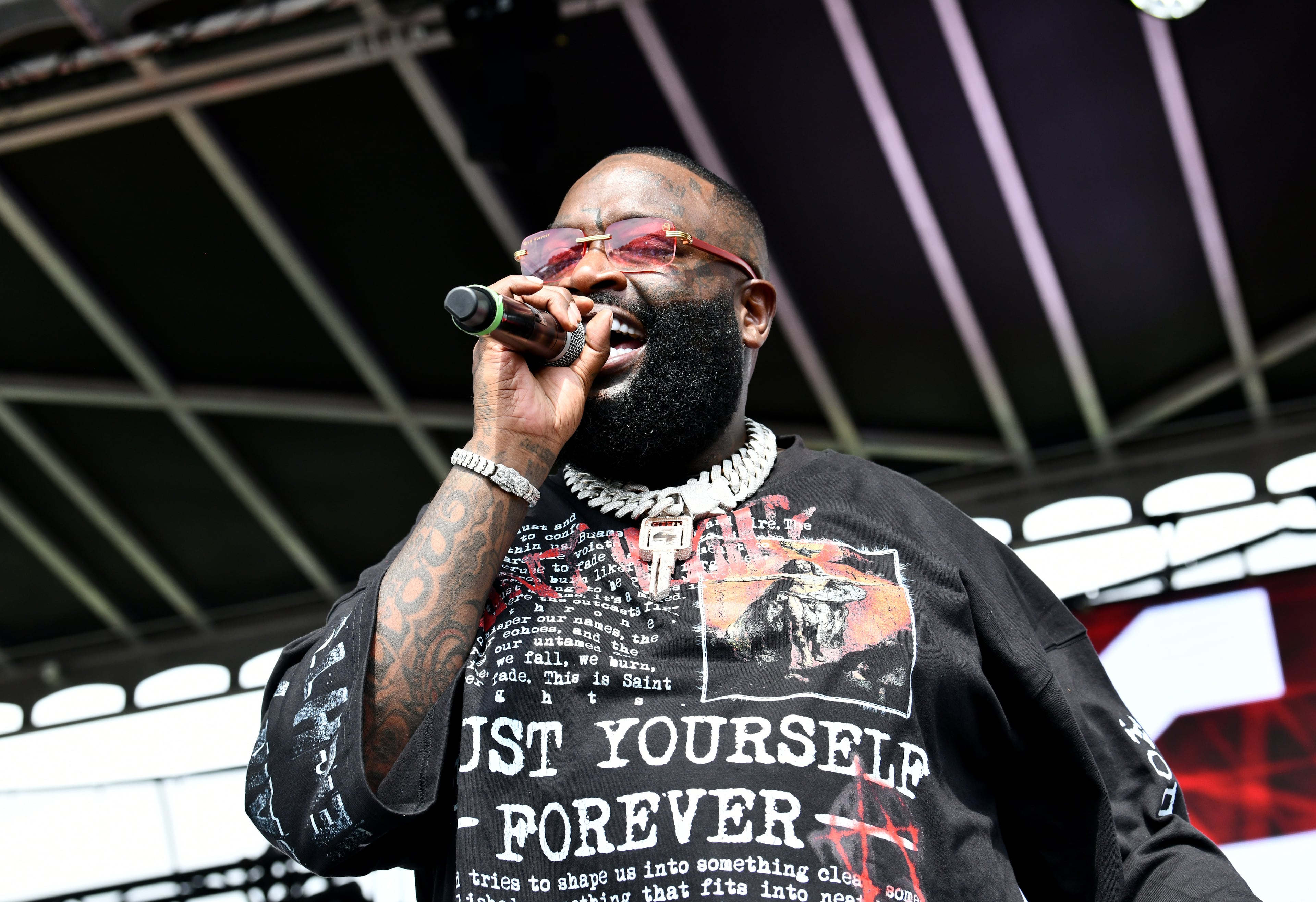 Rick Ross performs during the 4th Annual Rick Ross Car and Bike Show, Saturday, June 7, 2025, in Fayetteville. The 4th Annual Rick Ross Car and Bike Show will include a vendor market with more than 30 vendors, food trucks, fleets of classic/custom automobiles, luxury vehicles, boats, RVs and trailers on the front of the mansion. Stage performances include Plies, Ross' new signee Nino Breeze and Ross himself. (Hyosub Shin / AJC)