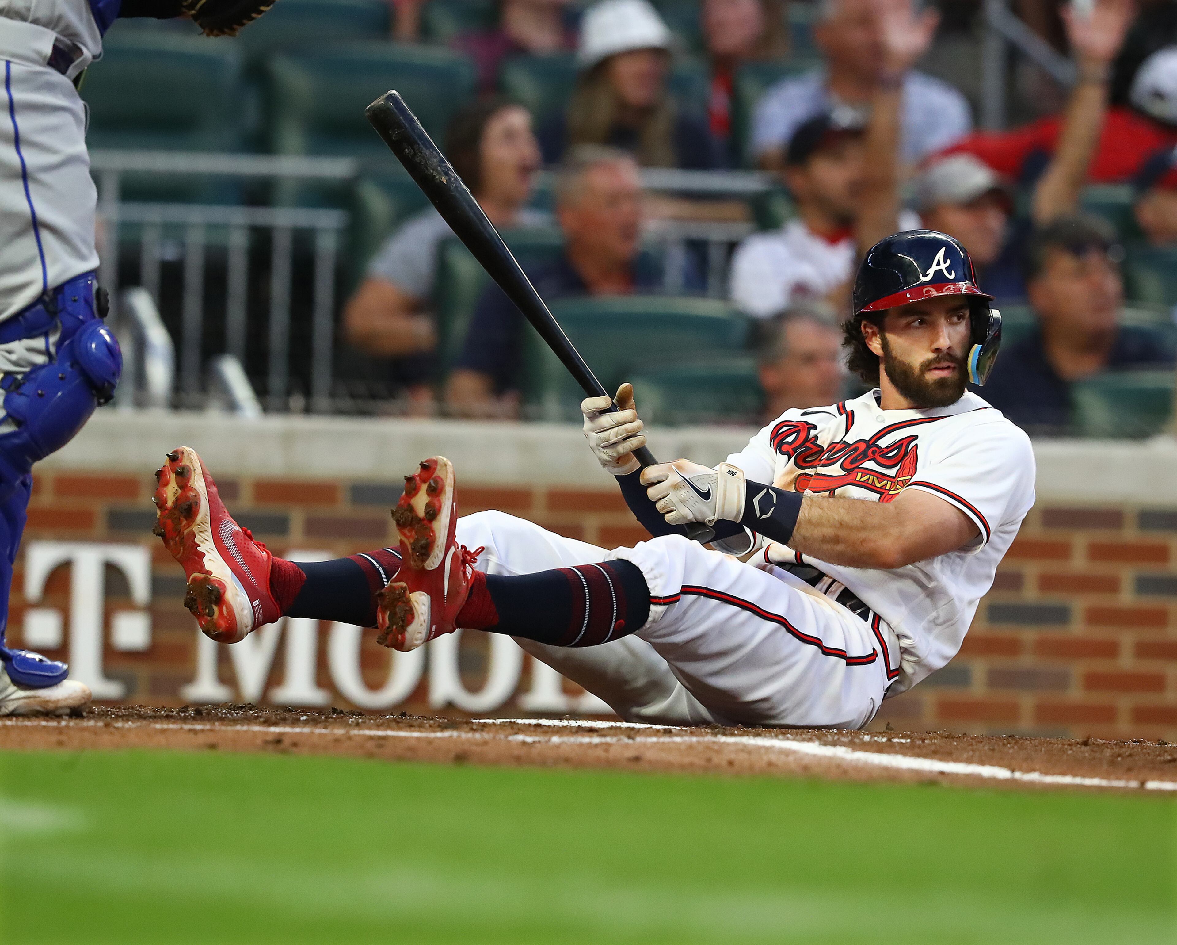 Braves batter Dansby Swanson looks at the pitcher after hitting the ground to avoid a pitch from New York Mets R.J. Alvarez during the third inning in a MLB baseball game on Tuesday, August 16, 2022, in Atlanta. “Curtis Compton / Curtis Compton@ajc.com