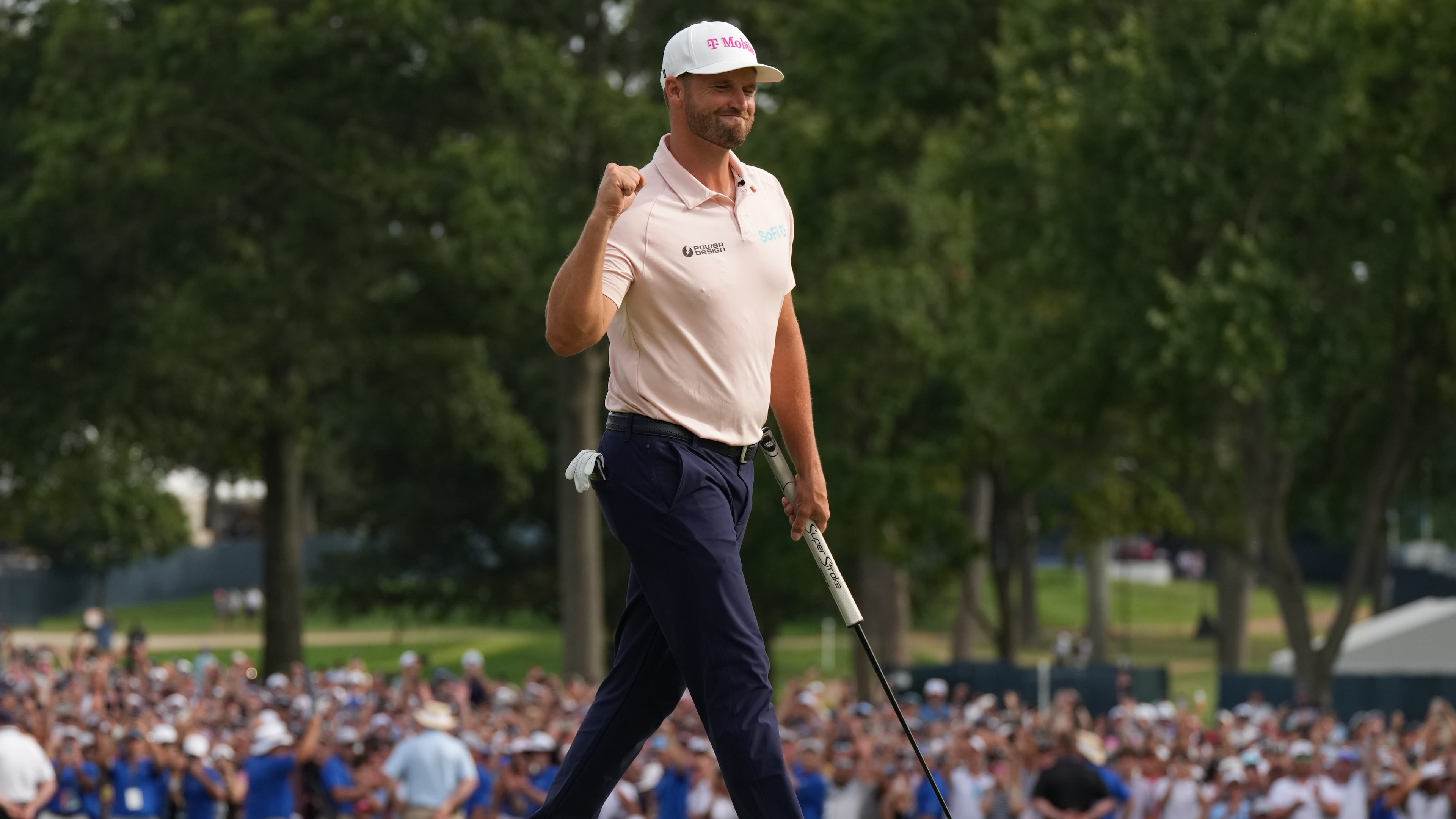Wyndham Clark celebrates winning on the 18th green in the final round of the BMW Championship golf tournament, Sunday, Aug. 23, 2026, in St. Louis. (AP Photo/Jeff Roberson)