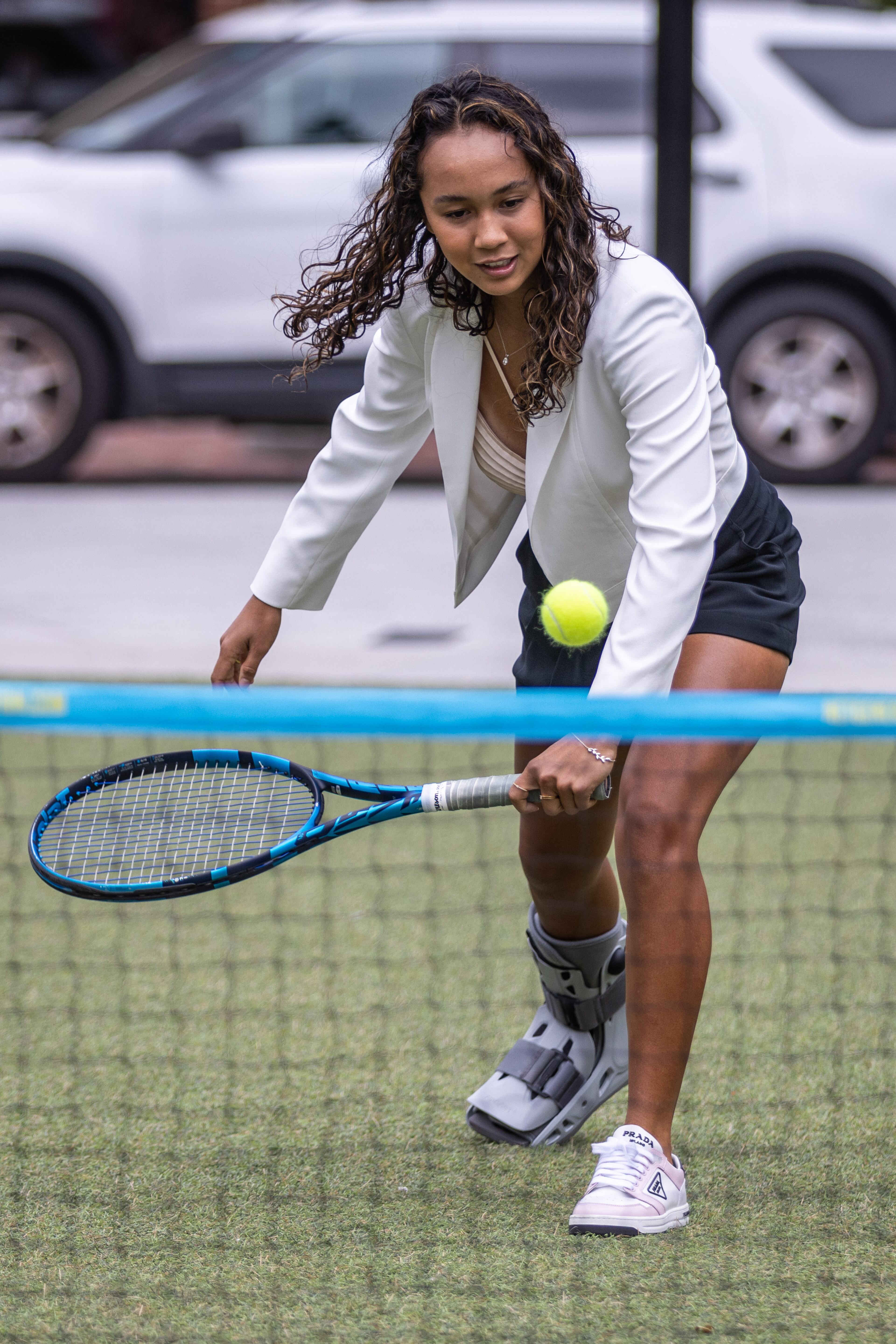 21-year-old Canadian tennis player Leylah Fernandez volleys with the official Ball Kids before the start of the Atlanta Open Media Day at Atlantic Station Tuesday, June 28, 2022. (Steve Schaefer / steve.schaefer@ajc.com)