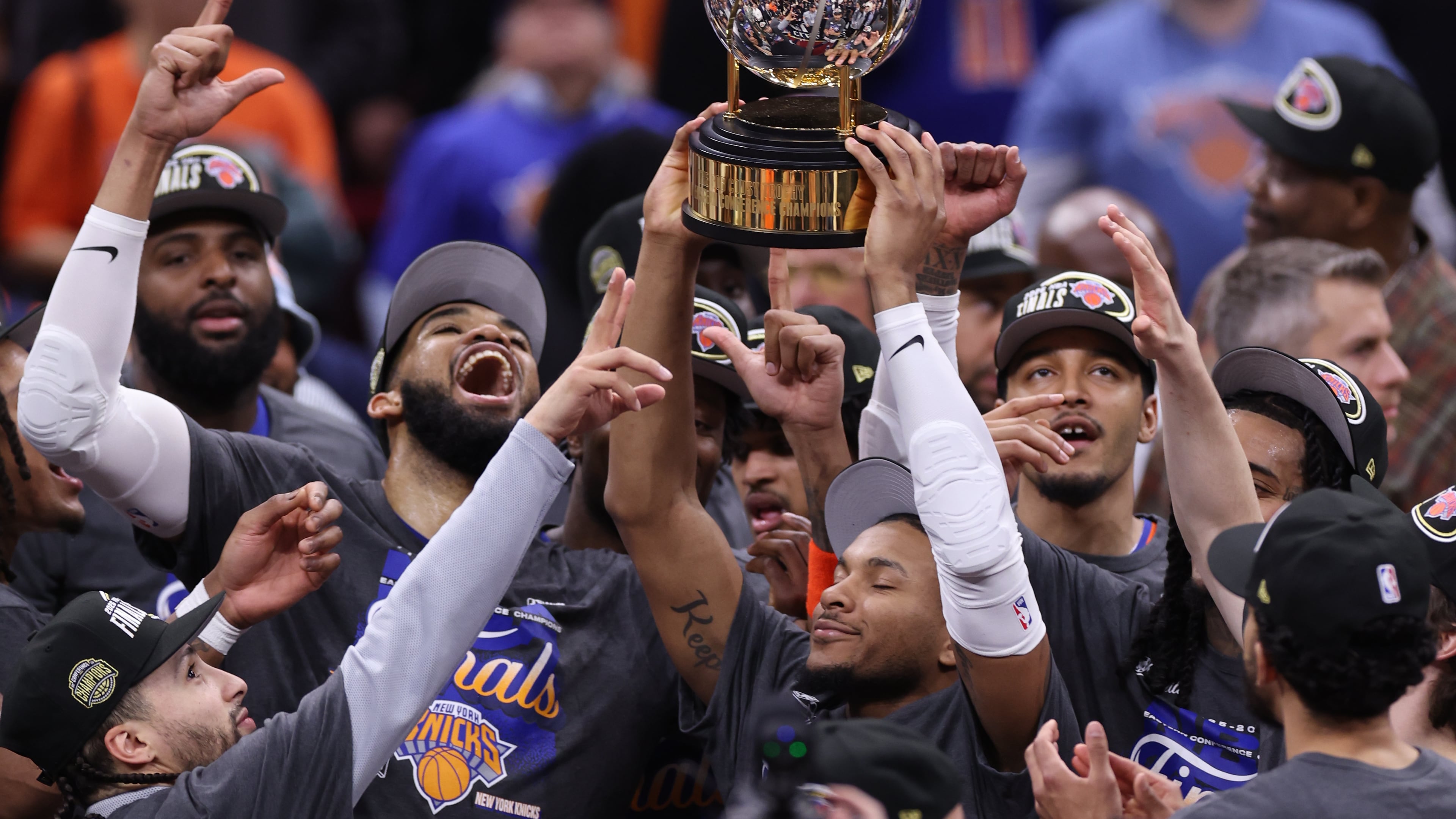 The New York Knicks hold the Eastern Conference Championship trophy after Game 4 in the Eastern Conference finals NBA basketball playoffs series against the Cleveland Cavaliers in Cleveland, Monday, May 25, 2026. (AP Photo/Tim Phillis)