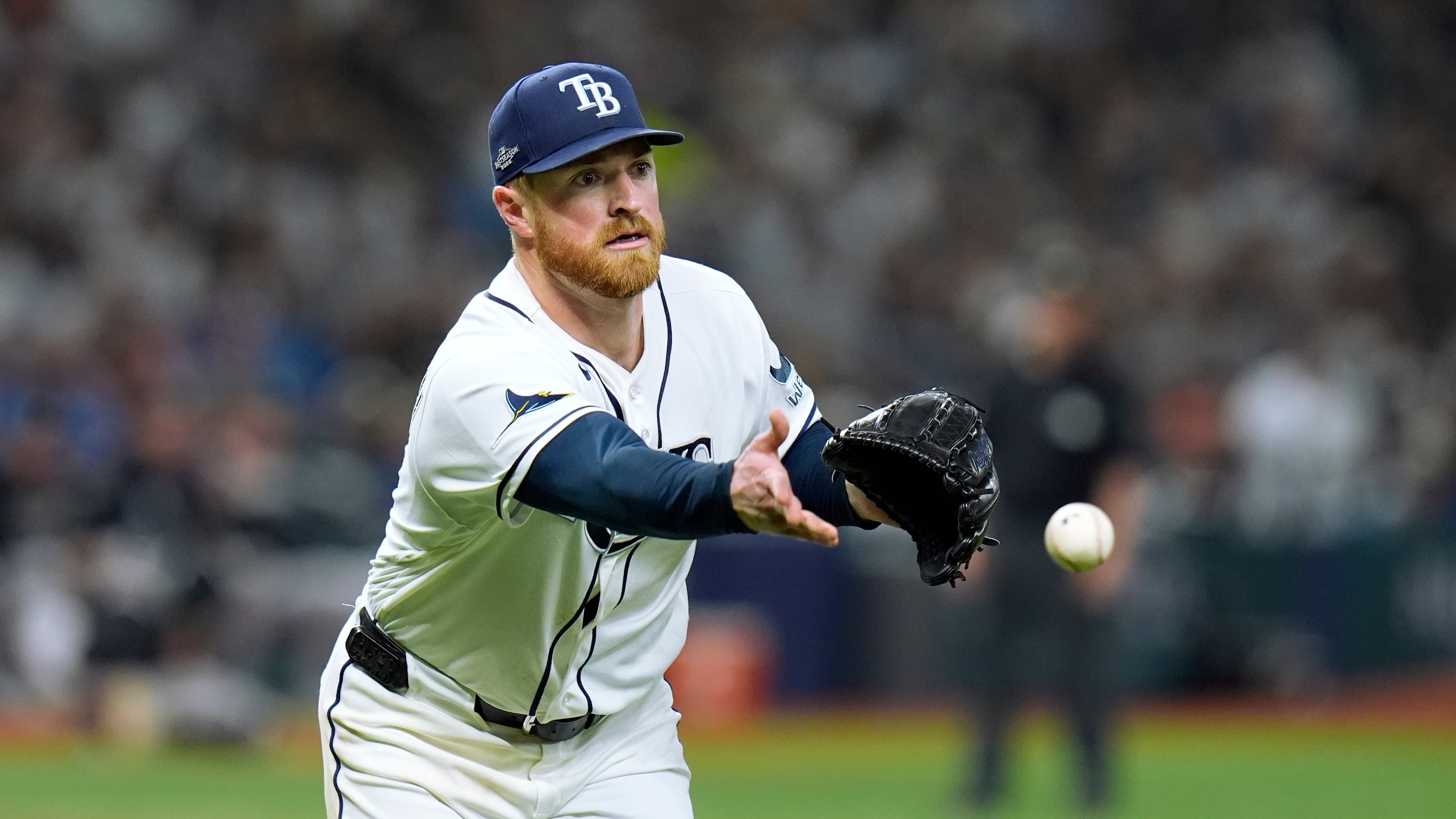 Tampa Bay Rays pitcher Drew Rasmussen tosses the ball to first base to throw out New York Yankees' Ryan McMahon on an attempted bunt during the sixth inning of Game 1 of an American League Division Series baseball game Saturday, Oct. 3, 2026, in St. Petersburg, Fla. (AP Photo/Chris O'Meara)
