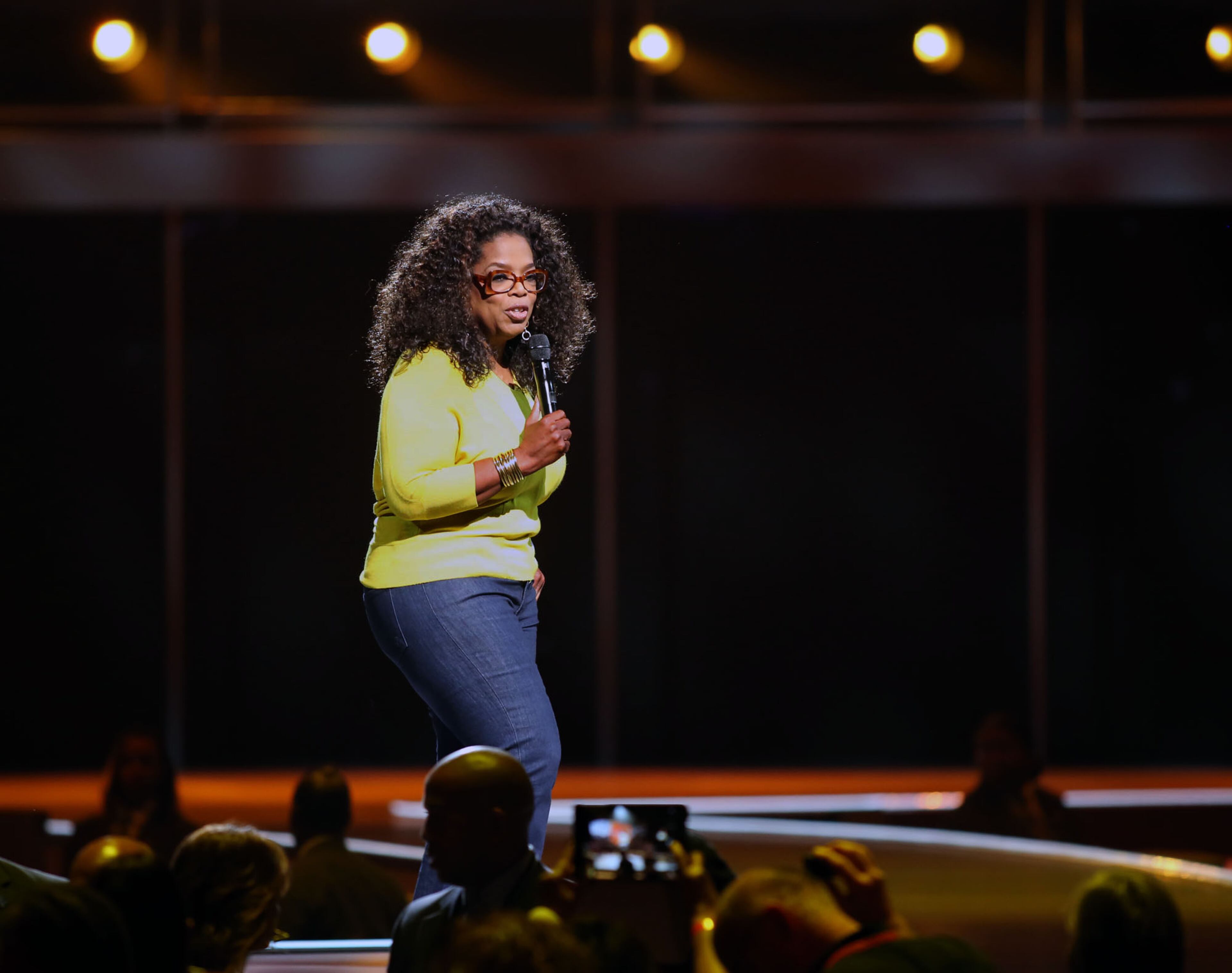 Oprah Winfrey takes the stage on the first stop of "The Life You Want Weekend" tour at the Philips Arena in Atlanta on Saturday, Sept. 6, 2014. (Akili-Casundria Ramsess/Special to the AJC)