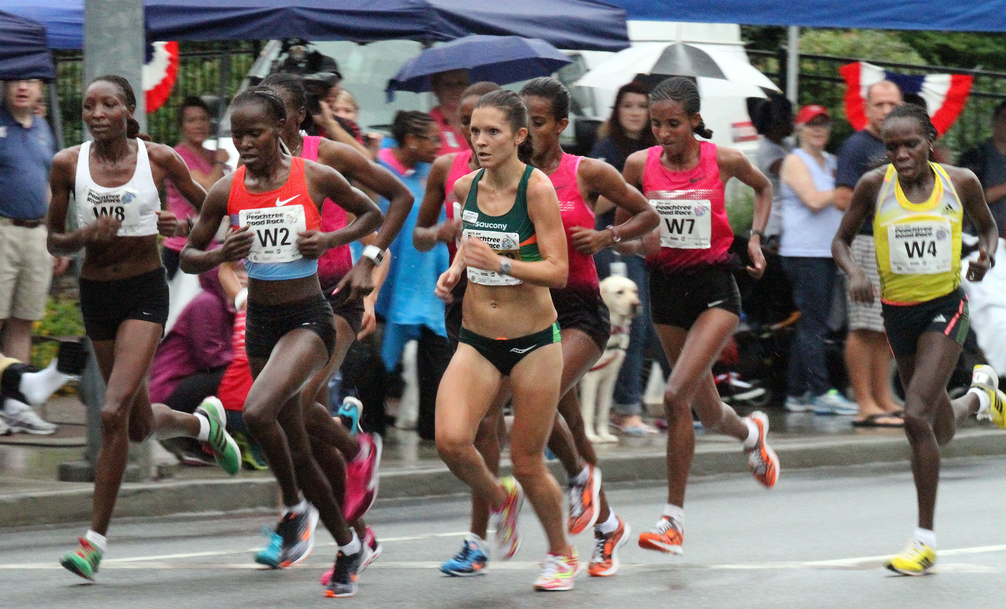 The elite women runners pass a crowd at the Shepherd Center during 44th running of the AJC Peachtree Road Race in Atlanta on July 4th, 2013. It is the world's largest 10k running event according to the Atlanta Track club who puts it on. PHIL SKINNER / PSKINNER@AJC.COM