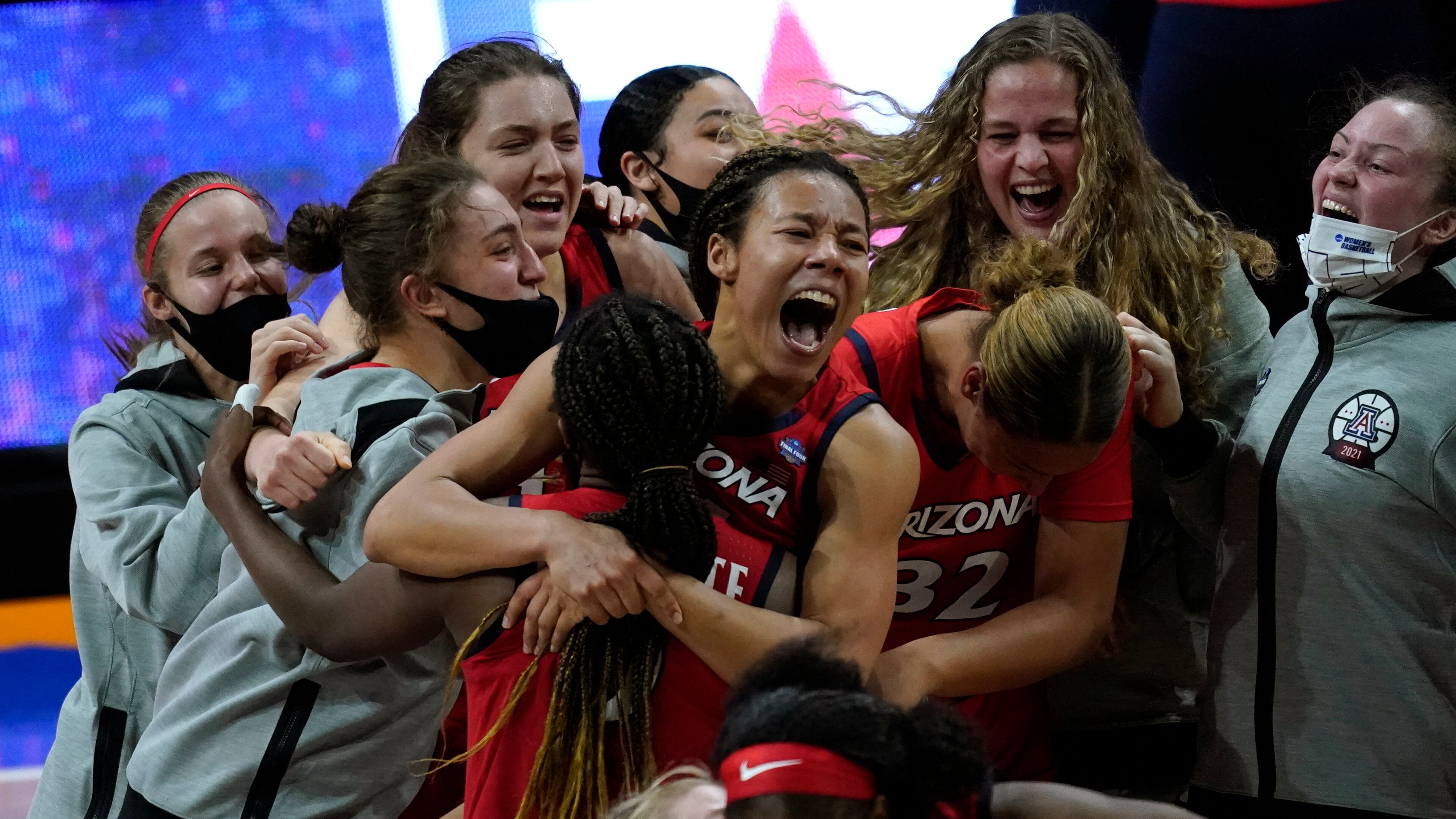 Arizona players celebrate after a women's Final Four NCAA college basketball tournament semifinal game against Connecticut Friday, April 2, 2021, at the Alamodome in San Antonio. Arizona won 69-59. (AP Photo/Eric Gay)