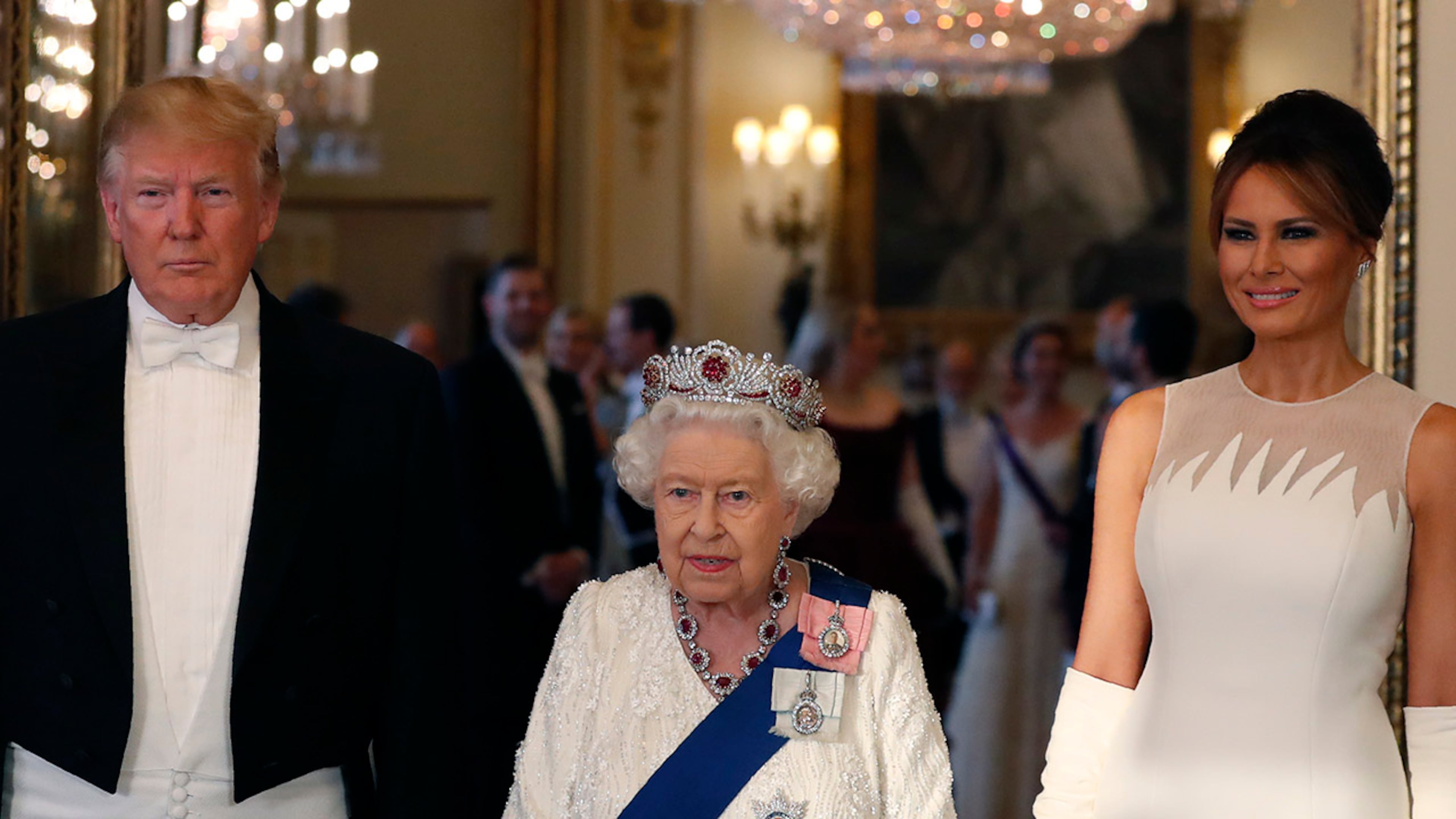 Britain's Queen Elizabeth II, center poses for a photo with President Donald Trump, left, and first lady Melania Trump ahead of the state banquet at Buckingham Palace in London, Monday, June 3, 2019. Trump is on a three-day state visit to Britain.