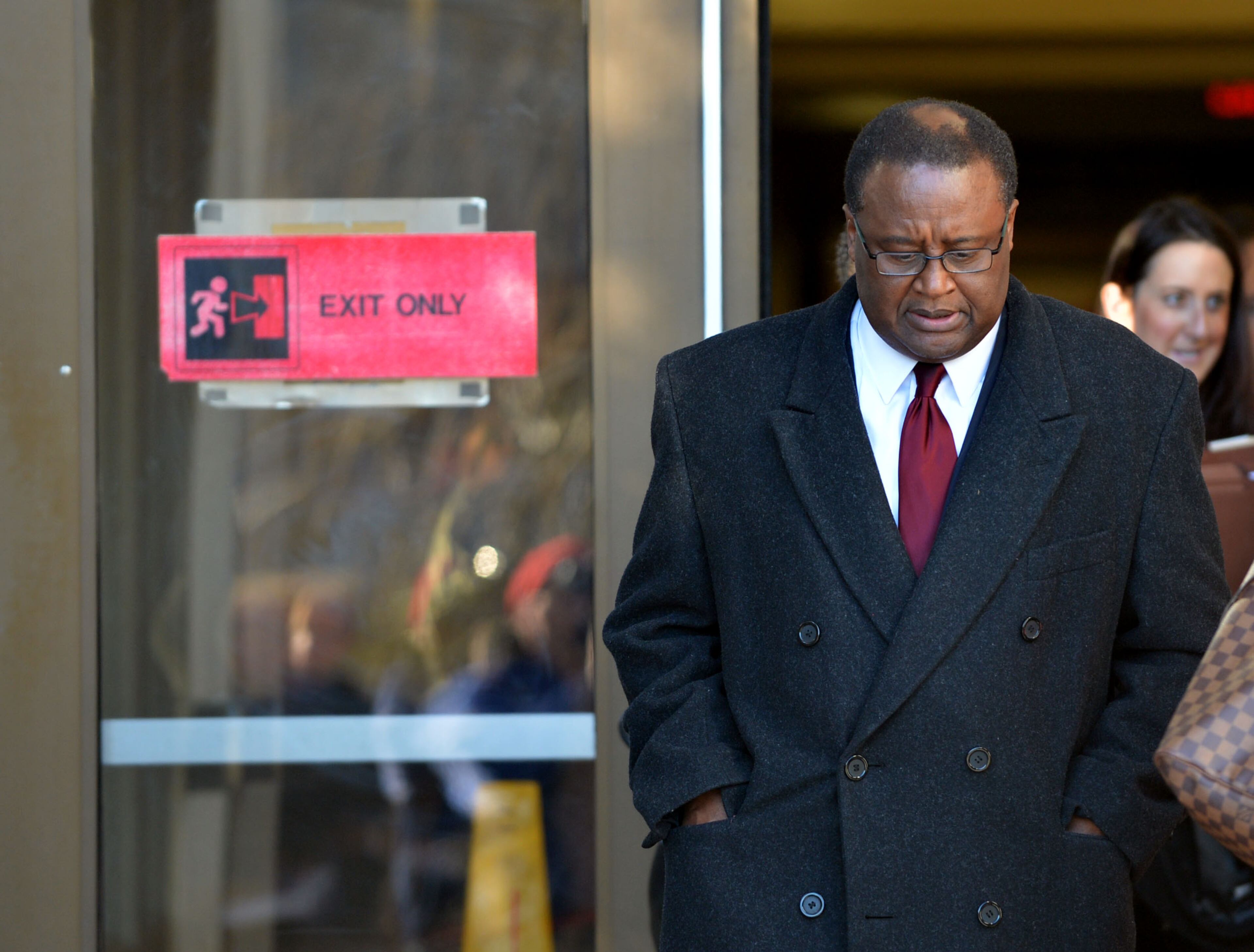 Crawford Lewis leaves the courthouse following the hearing. Judge Cynthia Becker heard from attorneys for former DeKalb School Superintendent Crawford Lewis in court Tuesday December 17, 2013. He is requesting that he be allowed to withdraw his guilty plea to a misdemeanor if she will not honor prosecutors' recommendation that he be sentenced to probation; no jail time. Lewis' attorney had asked for an "emergency hearing" the day after he was sentenced to 12 months in the DeKalb County Jail and taken out of the courtroom in handcuffs to begin serving his time. Becker set the hearing for eight days after he was sentenced. KENT D. JOHNSON / KDJOHNSON@AJC.COM