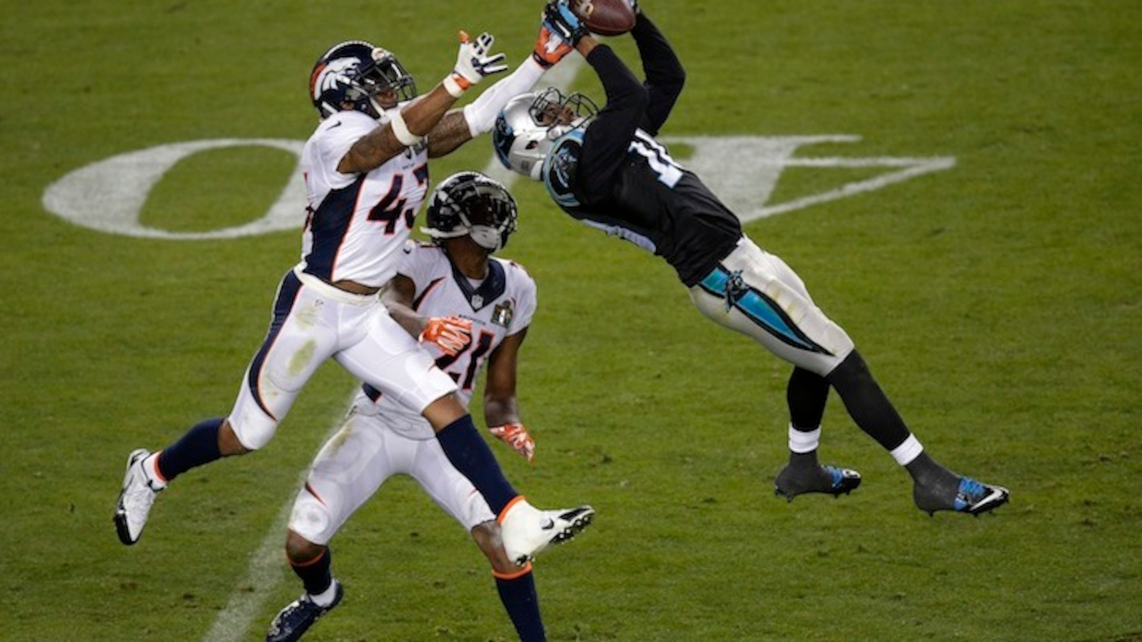 In this Feb. 7, 2016, file photo, Carolina Panthers’ Corey Brown (10) catches a pass in front of Denver Broncos’ T.J. Ward (43) and Aqib Talib (21) during the NFL Super Bowl 50 football game in Santa Clara, Calif. The NFL season will begin the way the last one ended, with the Broncos playing the Panthers. Denver beat Carolina 24-10 in February in the Super Bowl, Peyton Manning’s final game. The rematch will be on Thursday night, Sept. 8 in Denver. (AP Photo/Charlie Riedel, File