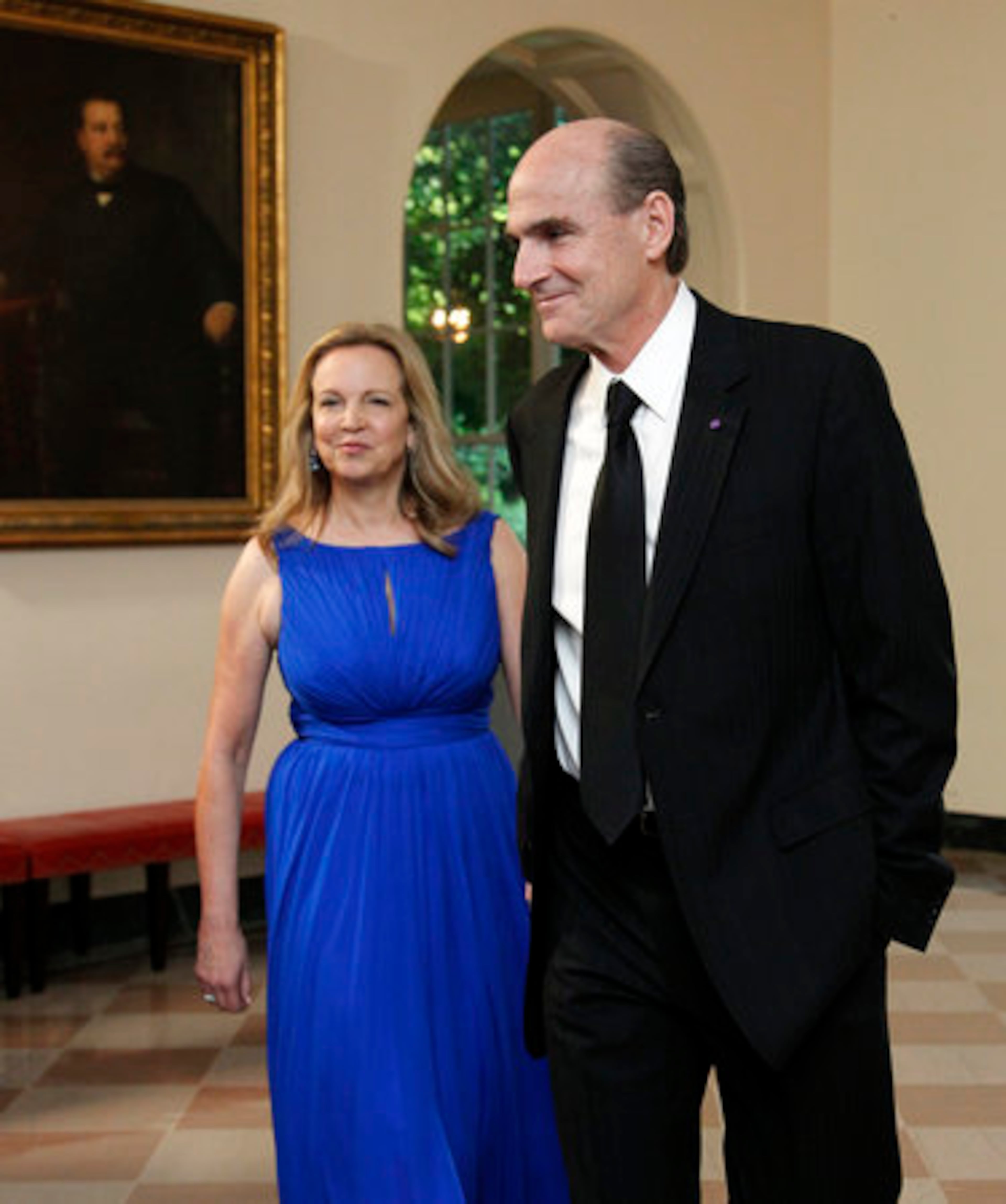 Singer James Taylor and his wife Caroline Taylor arrive for the State Dinner.
