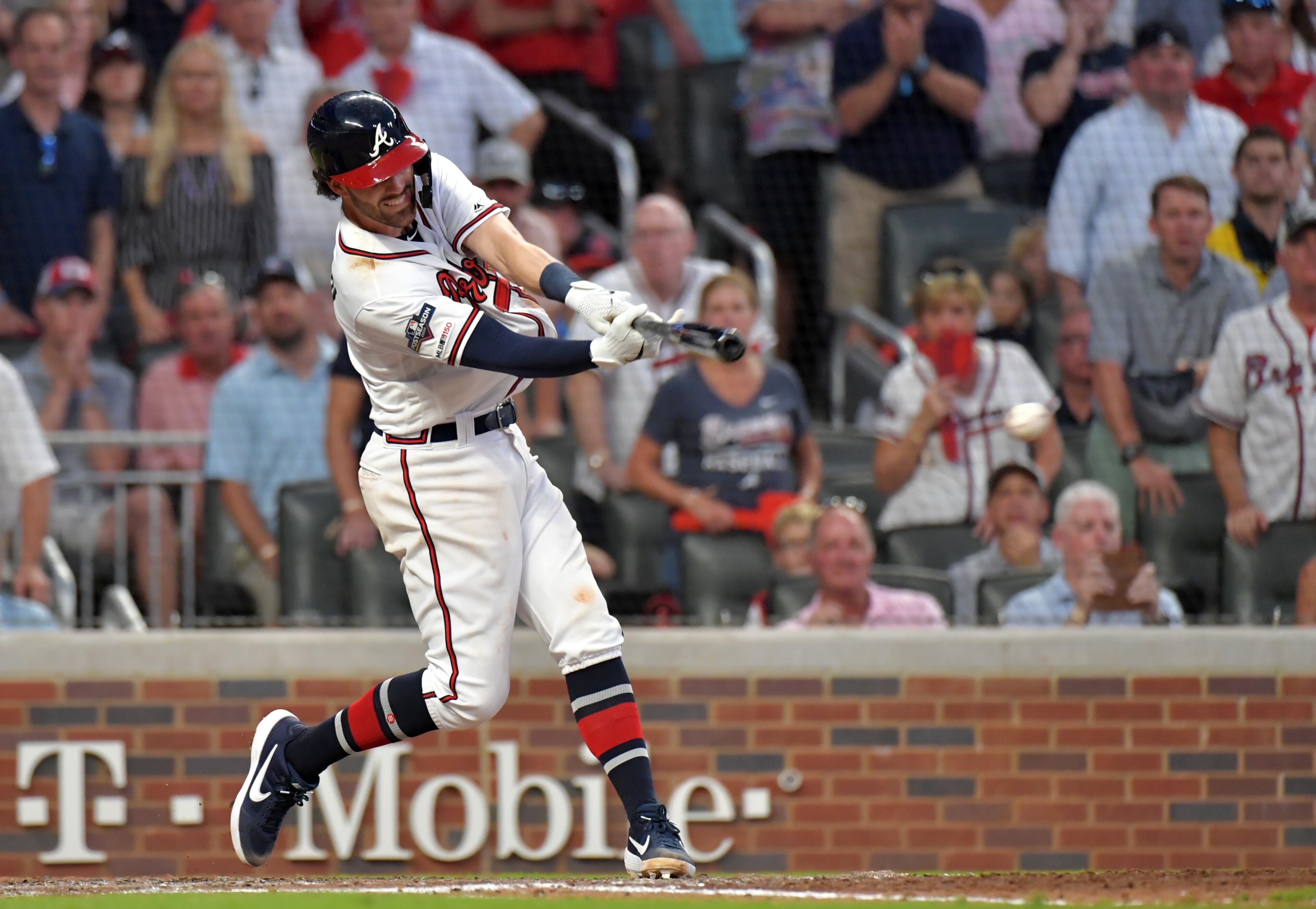 Braves shortstop Dansby Swanson hits a two-run single in the sixth inning against the St. Louis Cardinals during Game 1 of the best-of-five National League Division Series at SunTrust Park on Thursday, October 3, 2019. (Hyosub Shin / Hyosub.Shin@ajc.com)
