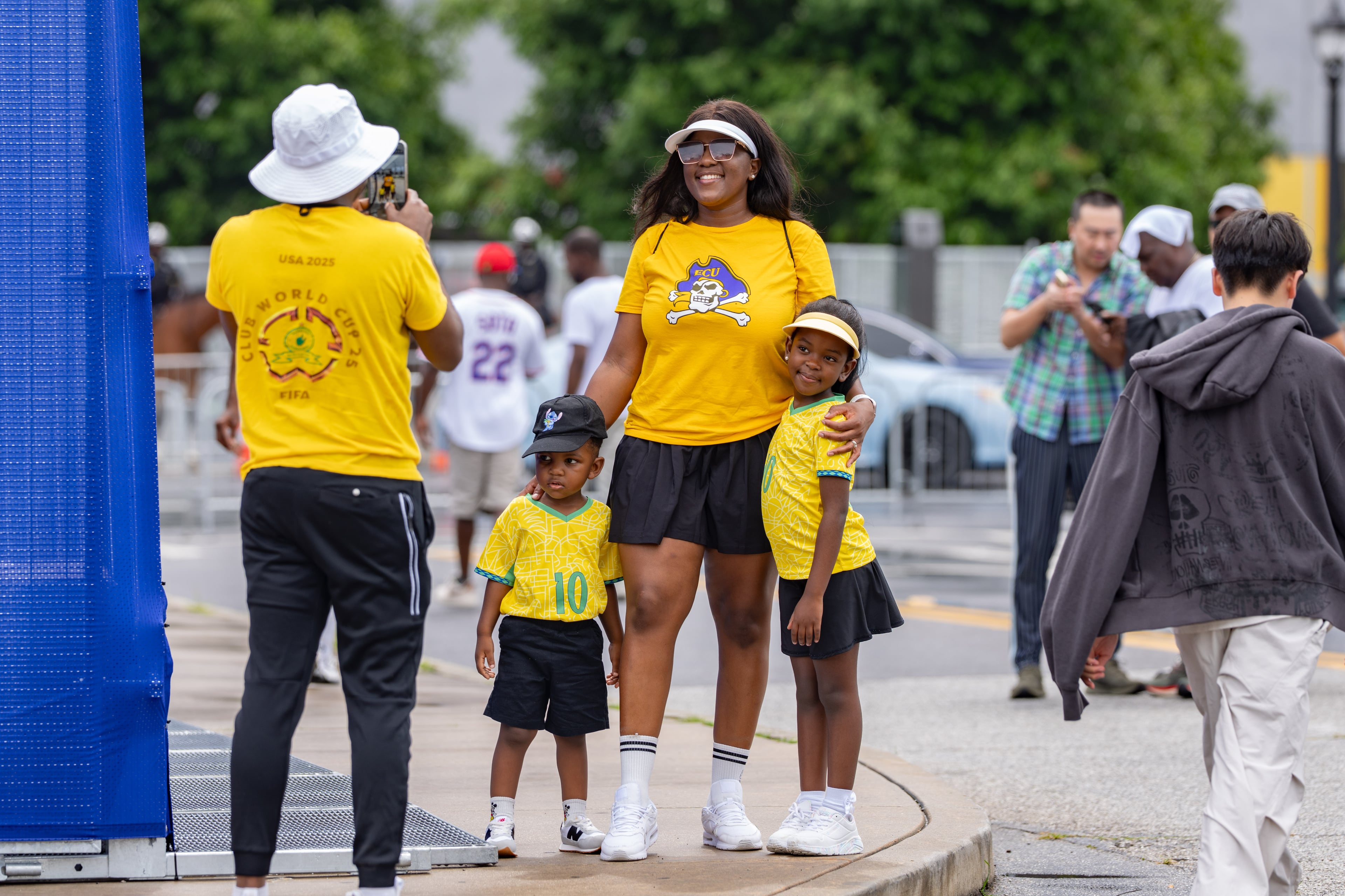 A family takes a photo in front of Atlanta Stadium ahead of the South Africa vs. Czechia match on Thursday, June 18, 2026. (Ben Hendren for the AJC)