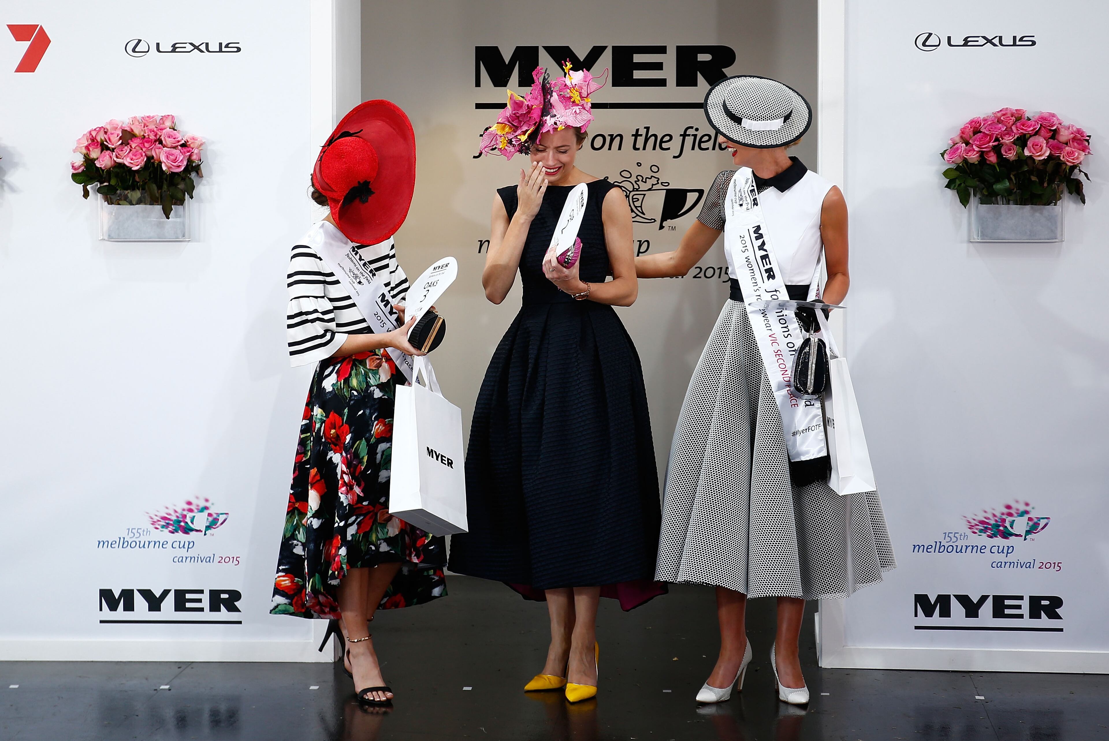 MELBOURNE, AUSTRALIA - NOVEMBER 05: Myer Fashions on the Field Victorian Women's Racewear State Award winner Emily Hunter (C) pose in the Myer Fashion on the Field Marquee on Crown Oaks Day at Flemington Racecourse on November 5, 2015 in Melbourne, Australia. (Photo by Zak Kaczmarek/Getty Images for the VRC)