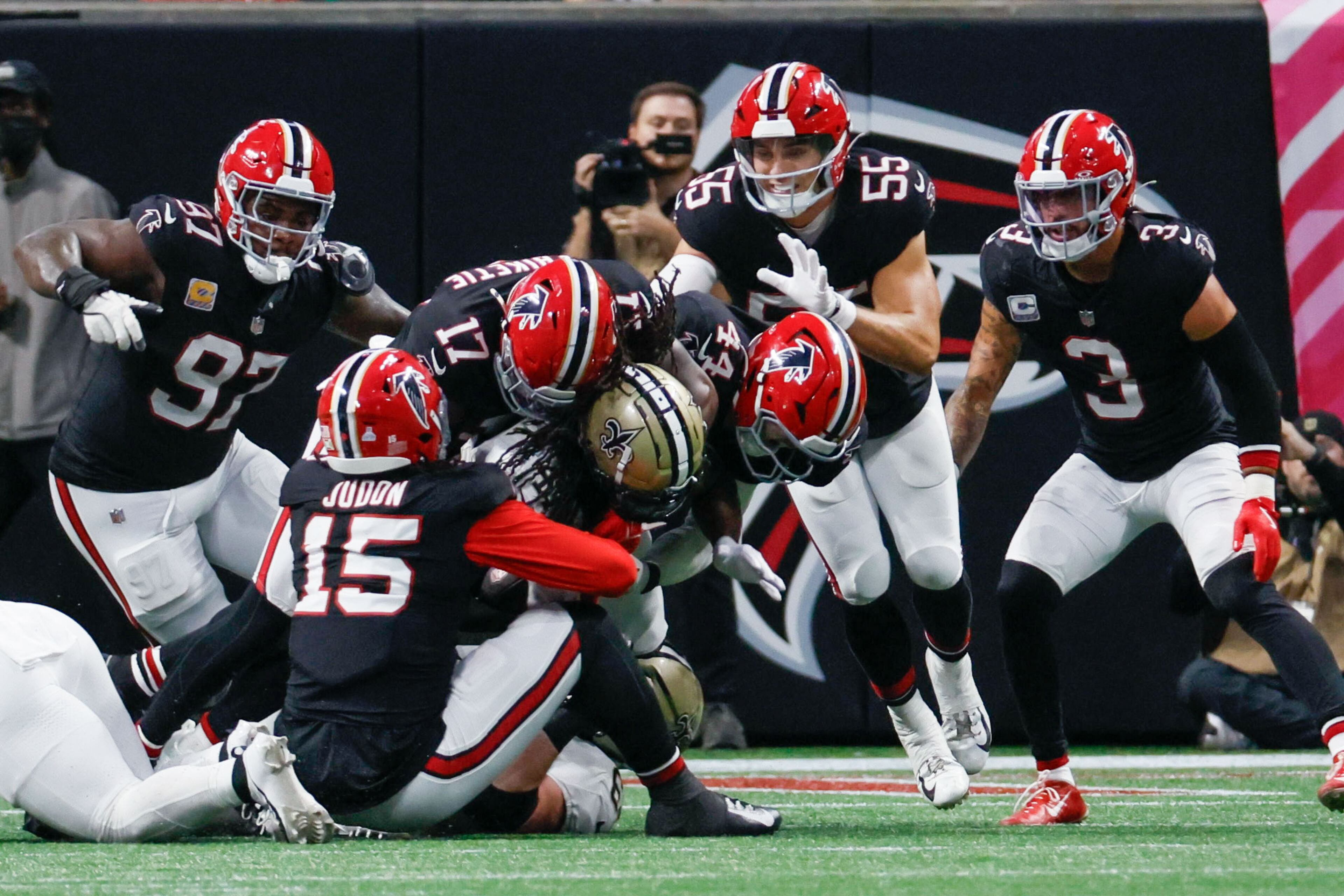 Falcons defensive linebackers tackle New Orleans Saints running back Alvin Kamara (41) during the second half of an NFL football game on Sunday, Sept. 29, at Mercedes-Benz Stadium in Atlanta.
(Miguel Martinez/ AJC)