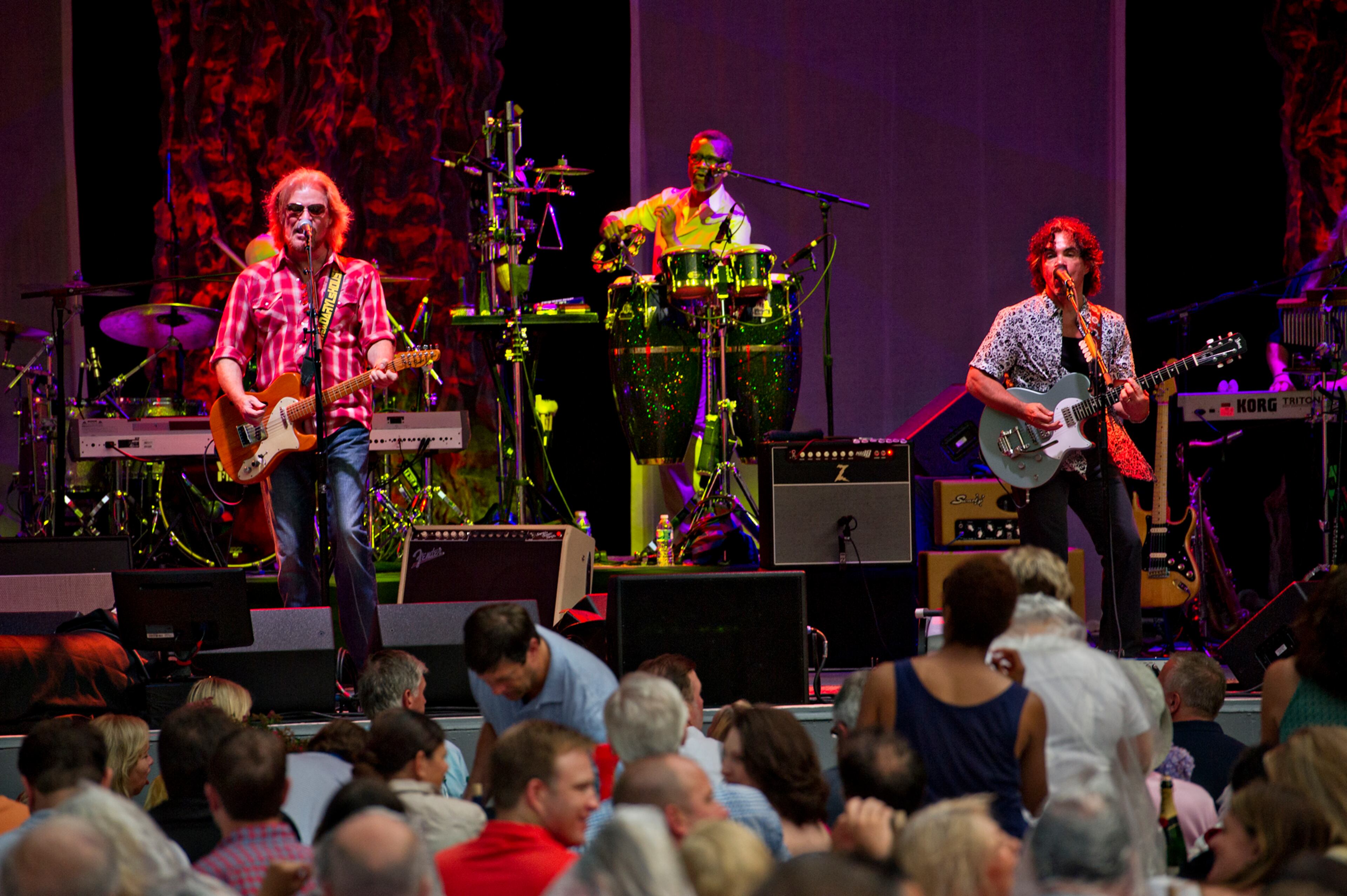 Daryl Hall (left) and John Oates perform Sunday, June 15, 2014 at Chastain Park Amphitheatre in Atlanta. JONATHAN PHILLIPS / SPECIAL