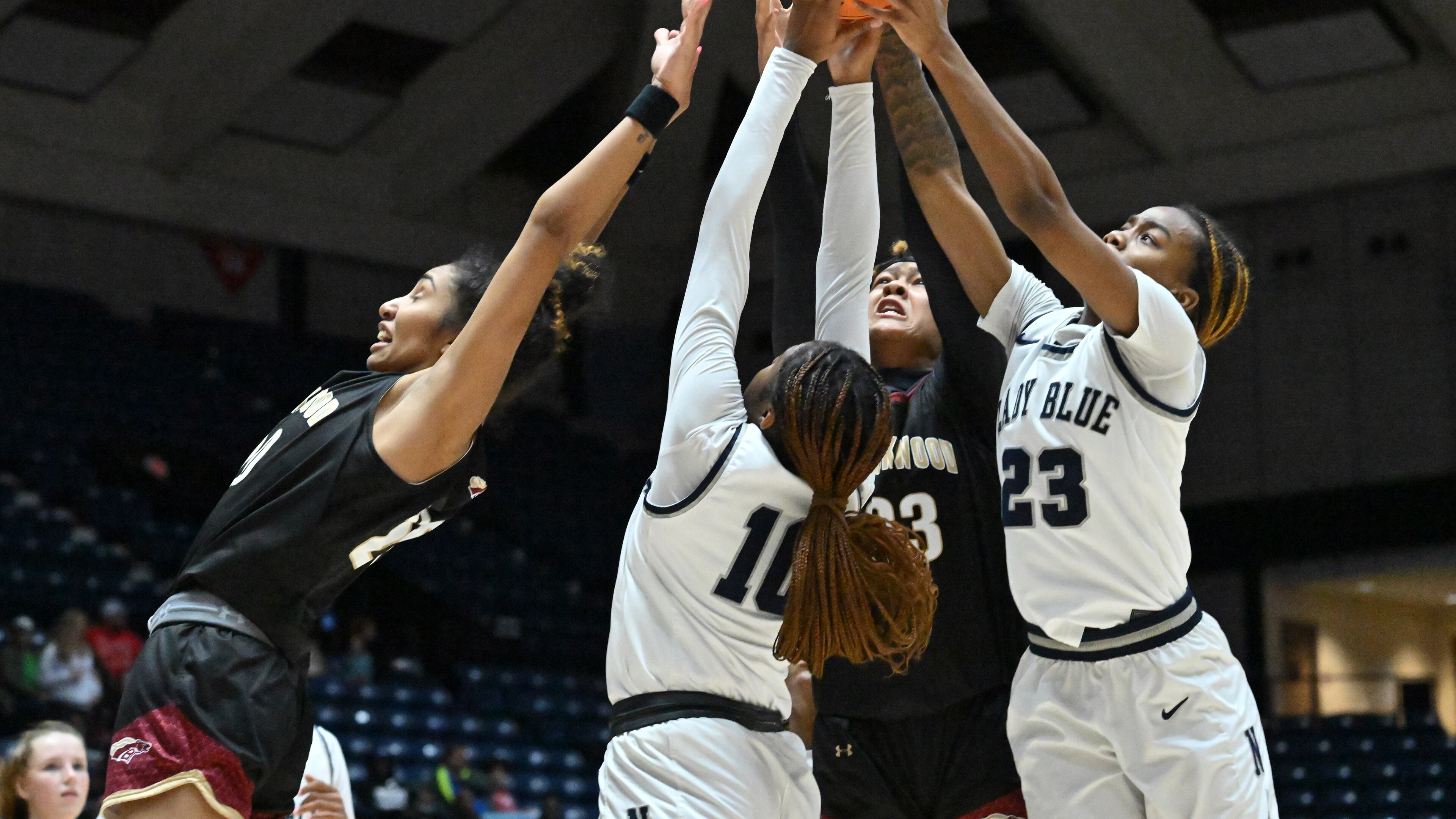 Brookwood's Diana Collins (left), Norcross' Kayla Lindsey (10) Brookwood's Jade Weathersby (23) and Norcross' Jania Akins (rihgt) fight for a rebound during 2023 GHSA Basketball Class 7A Girl’s State Championship game at the Macon Centreplex, Saturday, March 11, 2023, in Macon, GA. (Hyosub Shin / Hyosub.Shin@ajc.com)