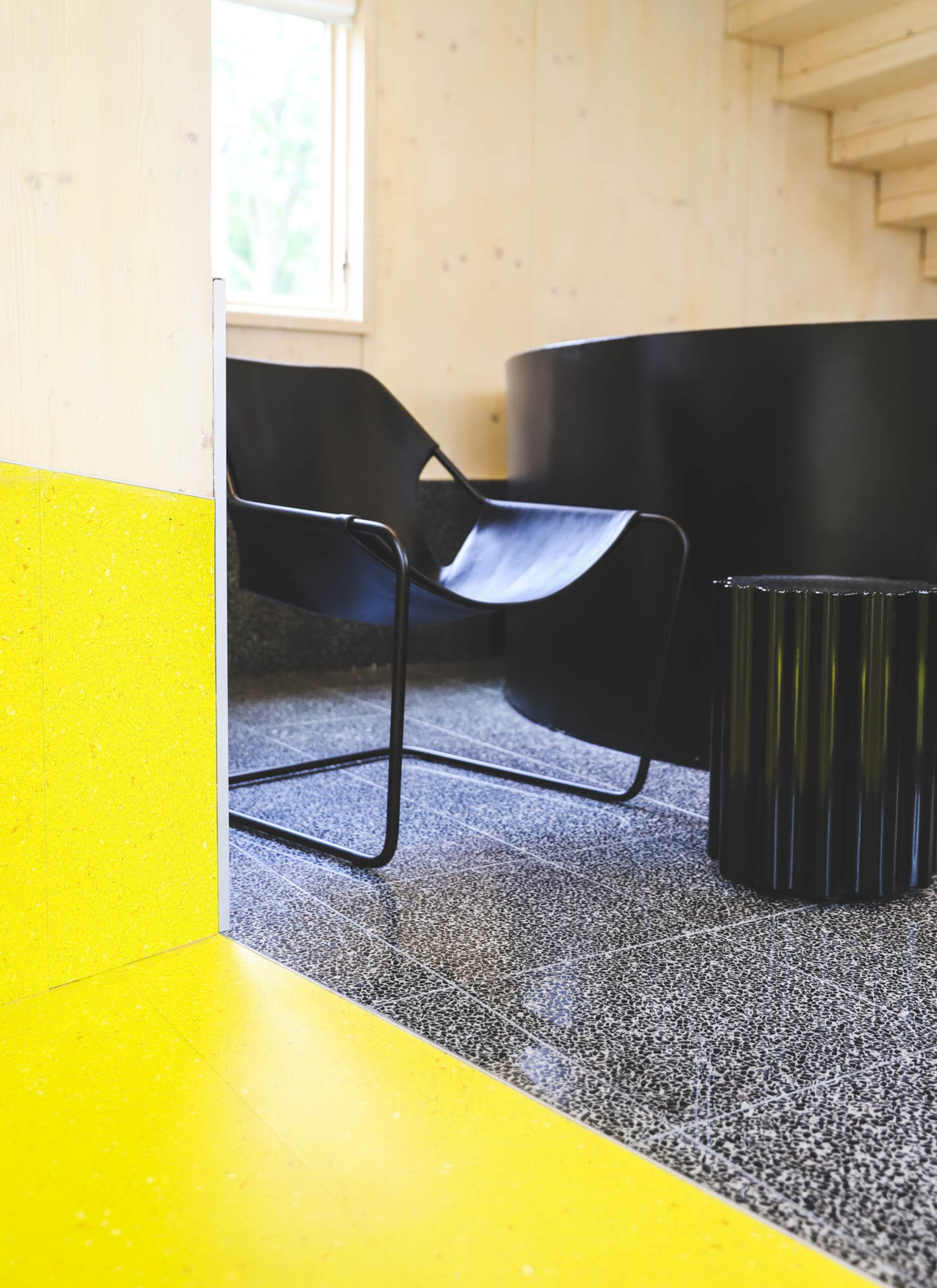 Black furnishings include the Paulistano leather armchair from DWR and Kartell's Colonna stool. Text by Lori Johnston/Fast Copy News Service. Photo by Reynolds Rogers/Fast Copy News Service.