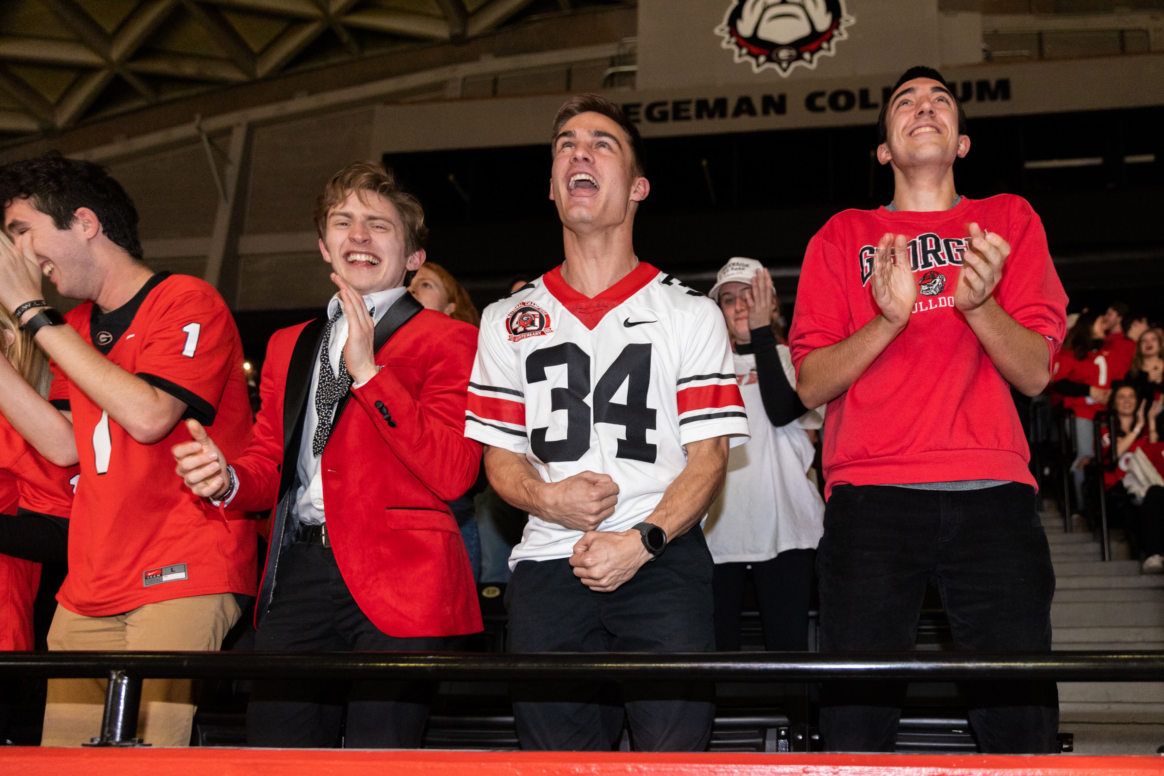 Georgia Bulldogs fans celebrate during the third quarter of the College Football Playoff national championship game at a watch party at Stegeman Coliseum on the University of Georgia campus on Monday, January 10, 2022. (Photo: Nathan Posner for The Atlanta Journal-Constitution)