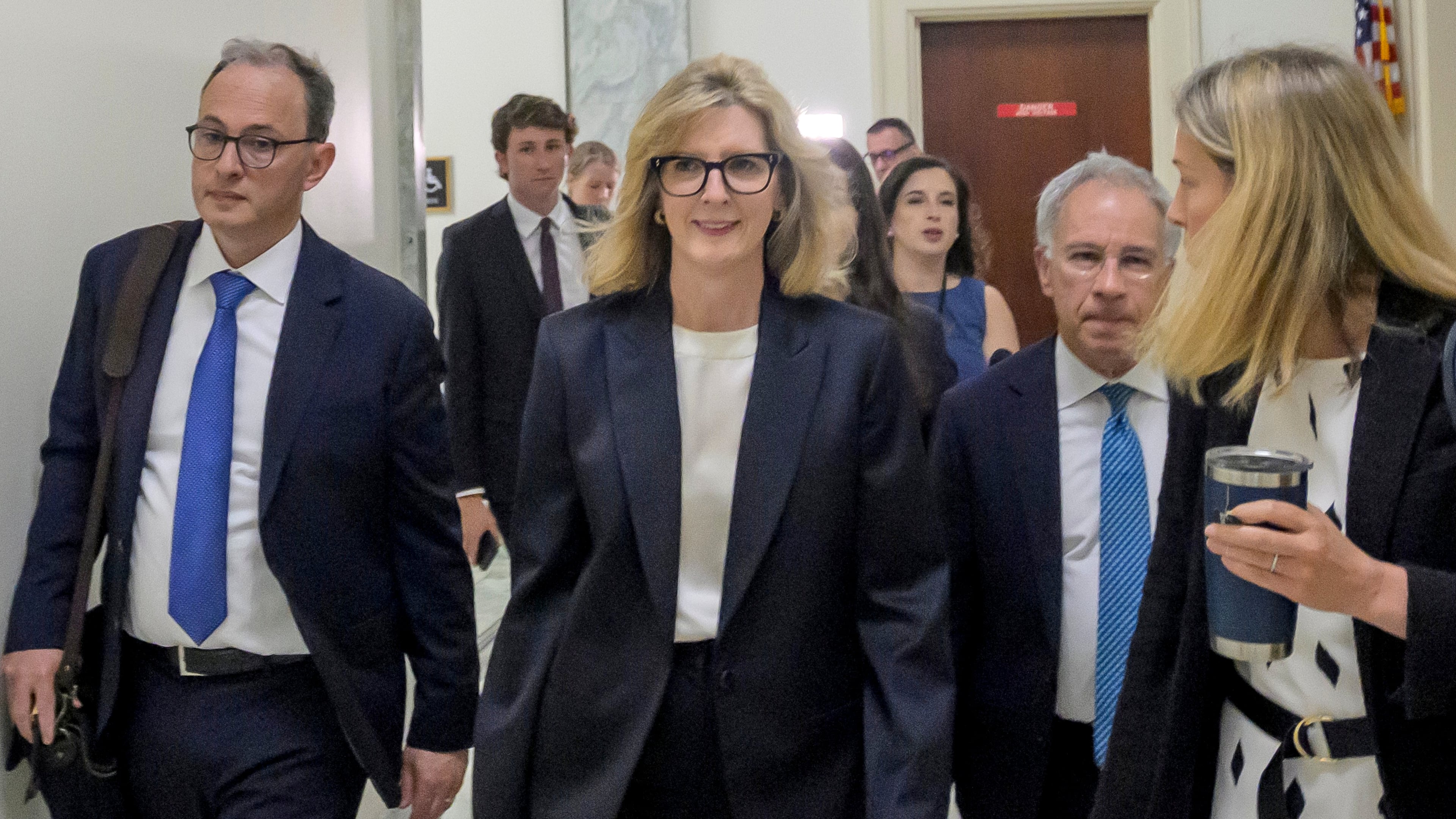 Goldman Sachs senior counsel Kathryn Ruemmler, center, arrives for a House Committee on Oversight and Government Reform hearing regarding her ties to Jeffrey Epstein, on Capitol Hill, Wednesday, July 15, 2026, in Washington. (AP Photo/Rod Lamkey, Jr.)