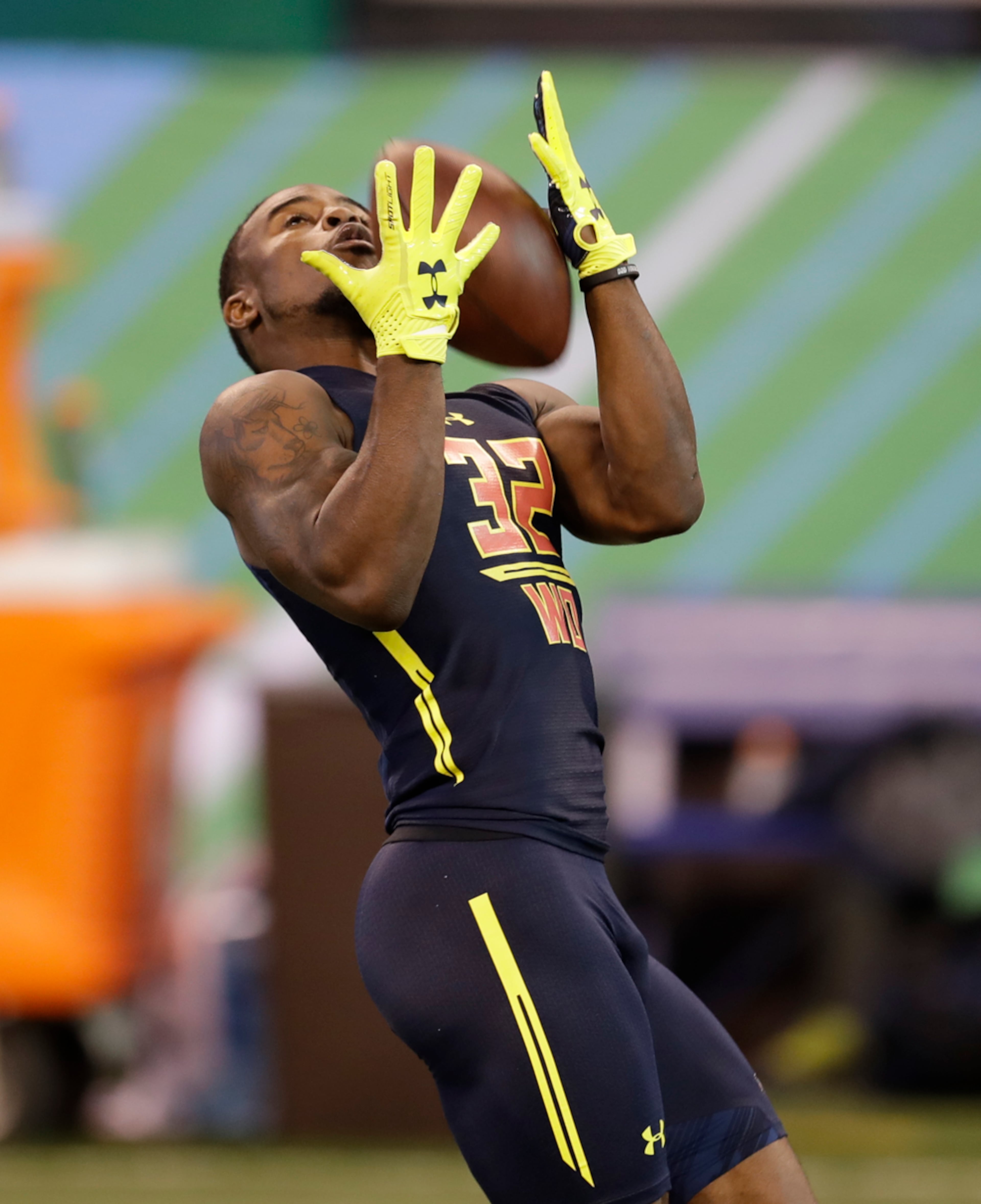 Georgia wide receiver Isaiah Mckenzie runs a drill at the NFL football scouting combine Saturday, March 4, 2017, in Indianapolis. (AP Photo/David J. Phillip)