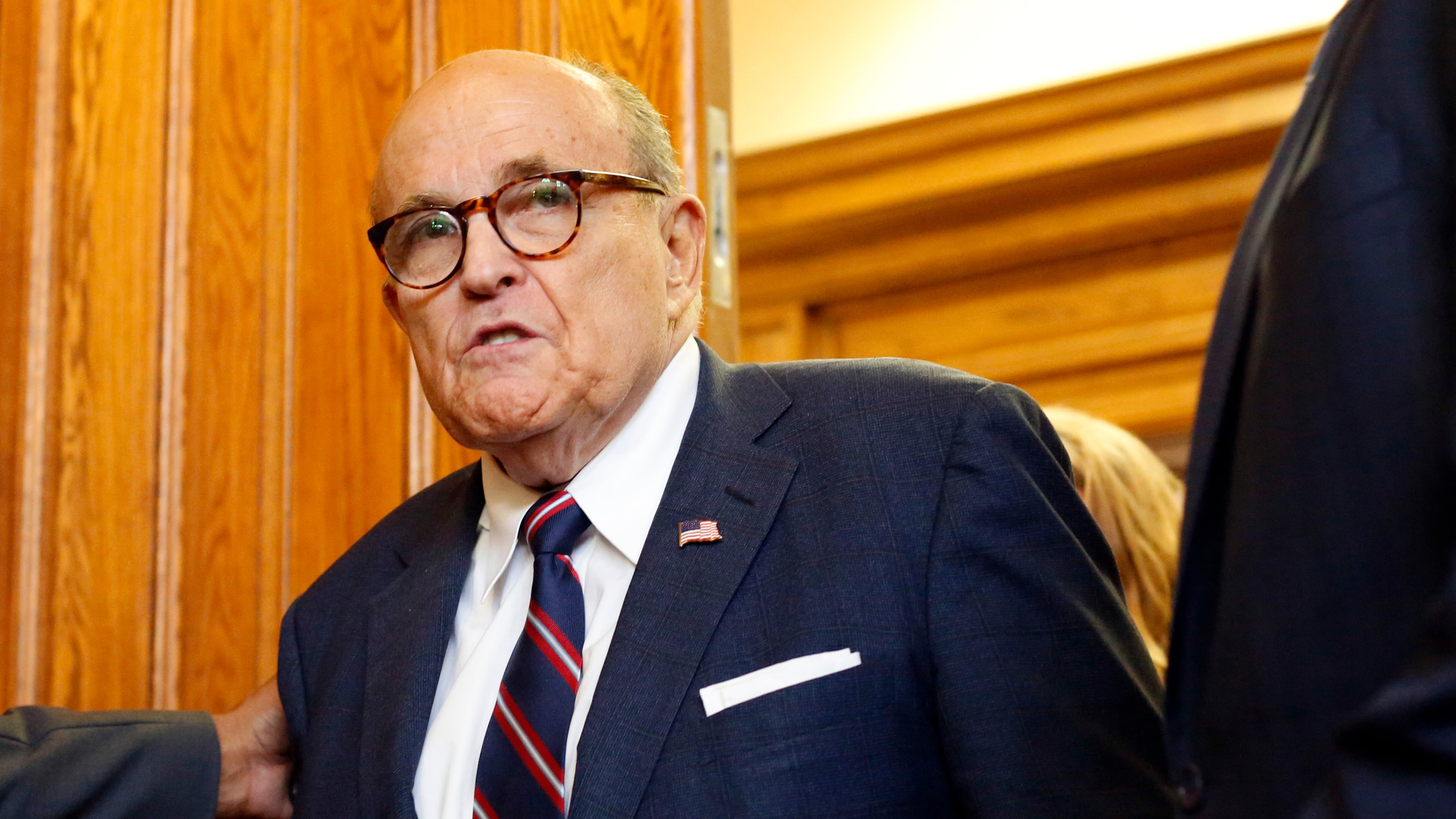 Rudy Giuliani walks to a senate hearing at the Georgia State Capitol in Atlanta on Thursday, December 3, 2020. The Georgia Senate Committee on Judiciary has formed a special subcommittee to take testimony of elections improprieties and evaluate the election process. (Rebecca Wright for the Atlanta Journal-Constitution)