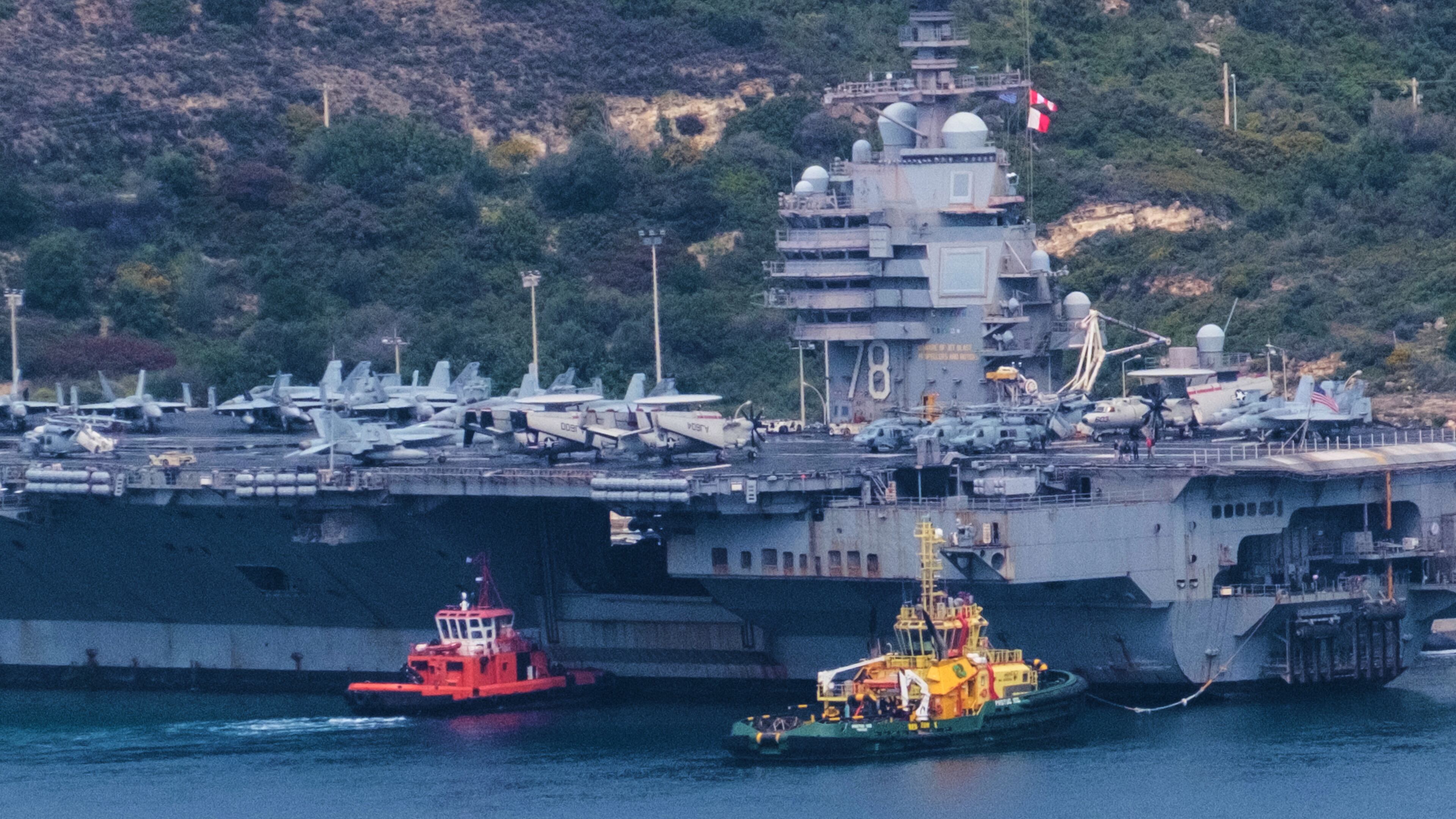 FILE - The USS Gerald R. Ford aircraft carrier is docked at Souda Naval Base near Chania on the island of Crete, Monday, March 23, 2026. (AP Photo/Giannis Angelakis).