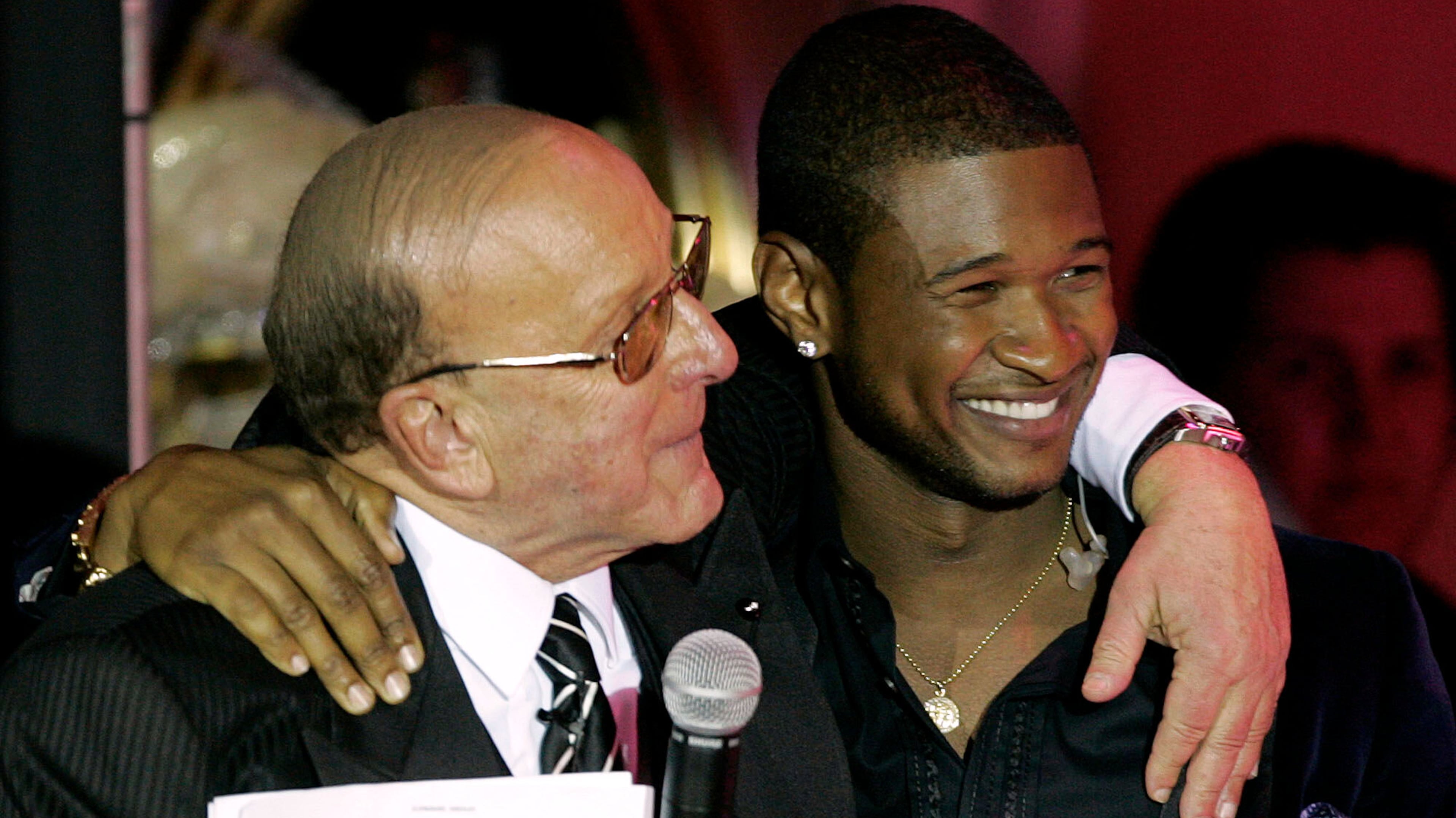 Clive Davis, left, and Usher appear at Davis' 2005 pre-Grammy party in Beverly Hills, Calif., on Feb. 12, 2005. (Chris Polk/AP)