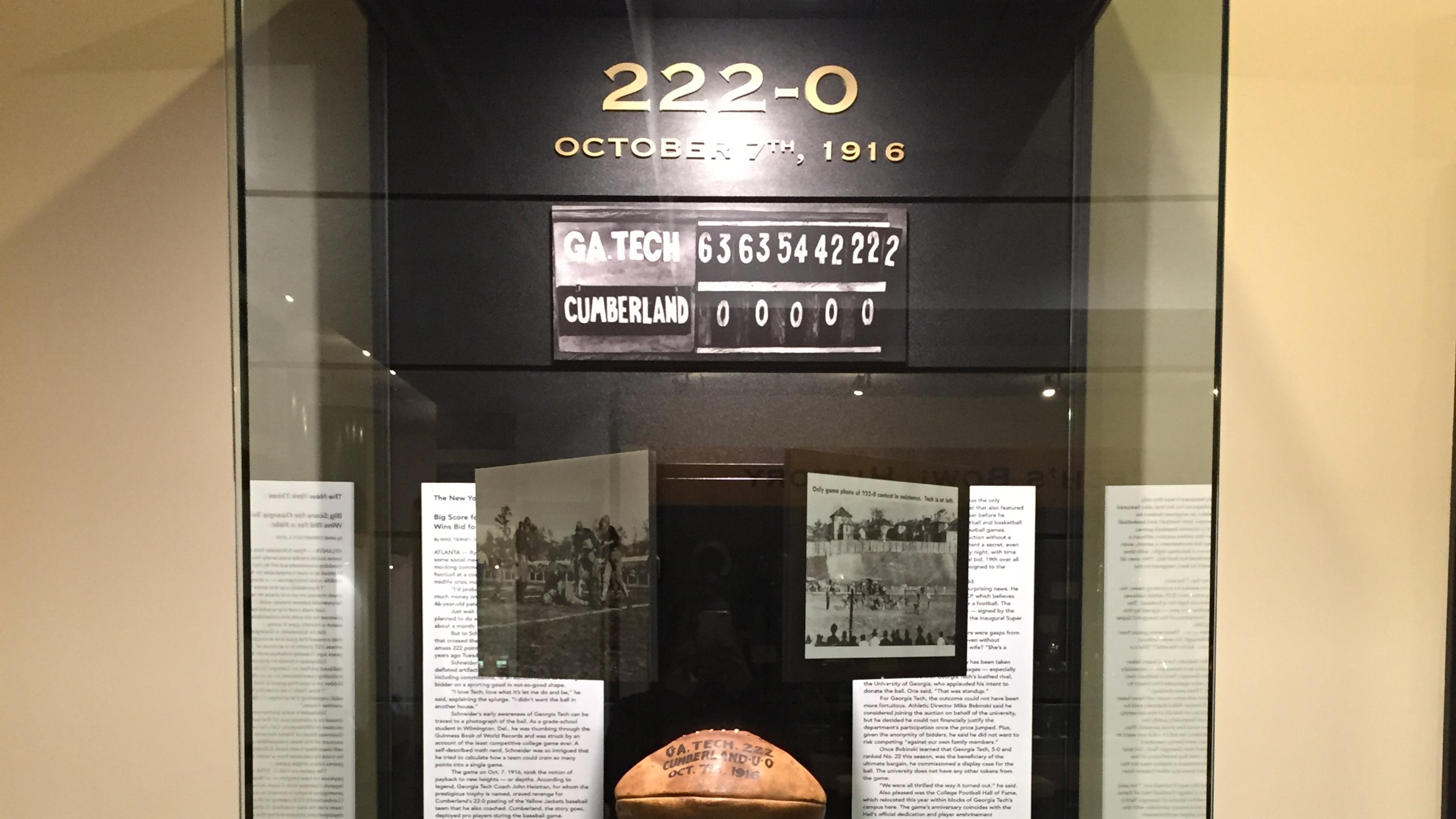 The game ball from Georgia Tech's 222-0 win over Cumberland in 1916 in its display case at the Edge Center. (GTAA)