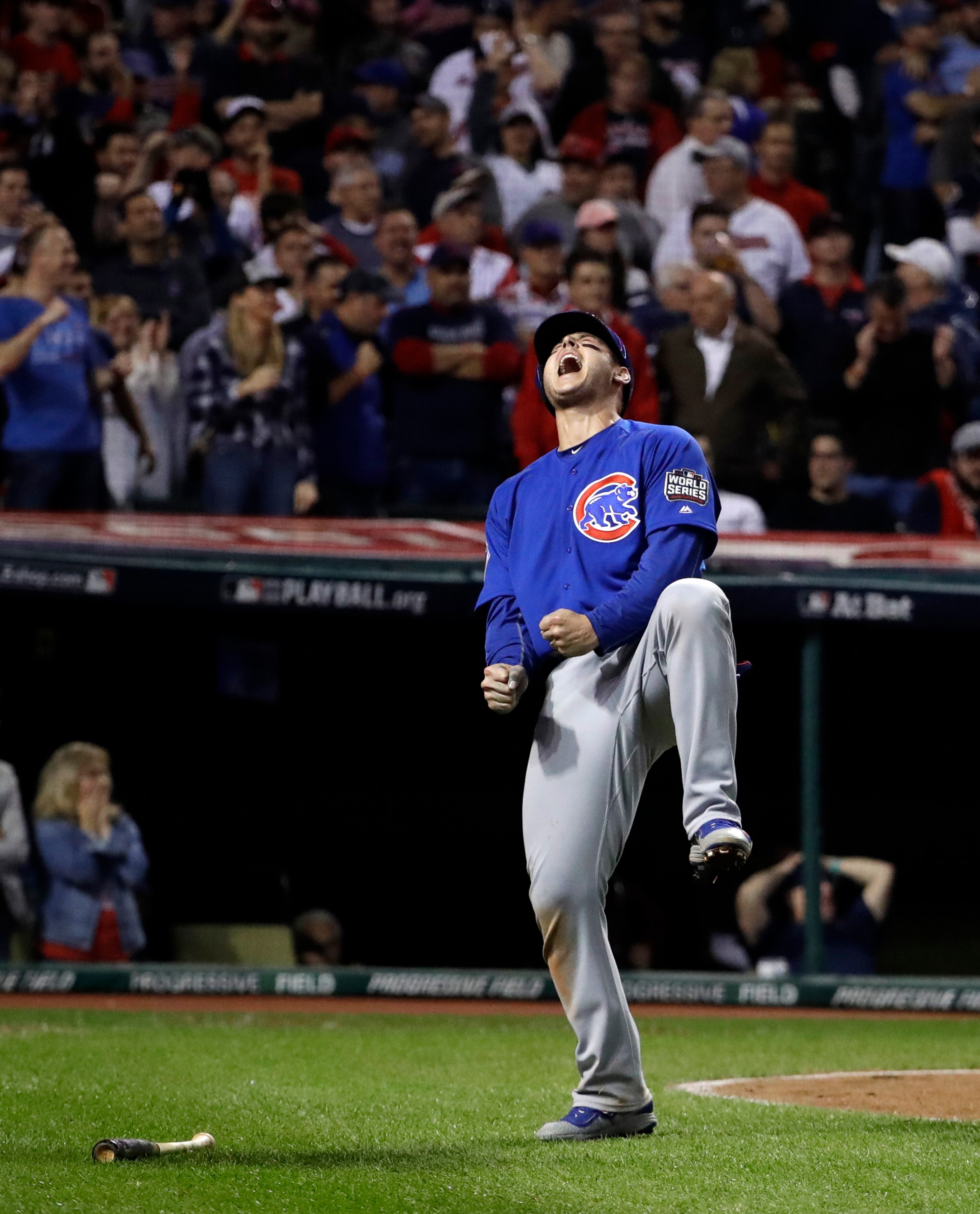 Chicago Cubs' Anthony Rizzo reacts after scoring on a hit by Miguel Montero during the 10th inning of Game 7 of the Major League Baseball World Series against the Cleveland Indians Wednesday, Nov. 2, 2016, in Cleveland. (AP Photo/David J. Phillip)