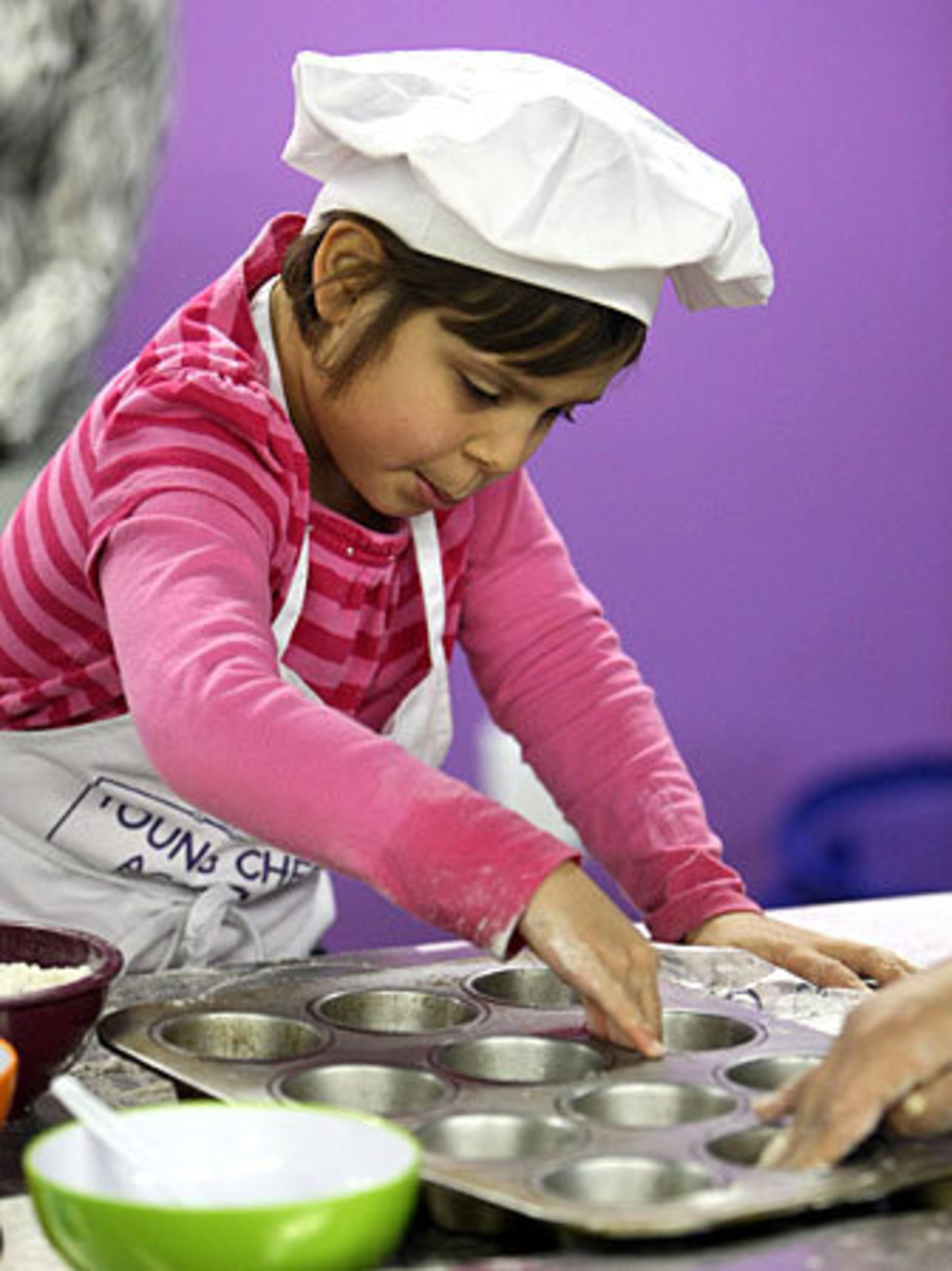 Call them 'koodies.' Kids are getting in on the cooking act - from future gourmands to prospective pastry chefs, kids are as influenced by cooking shows as the rest of us. Here, seven-year-old Julia Carroll works on making Canadian Maple Sugar Pies during a cooking class at the Young Chefs Academy in the Toco Hills shopping center.