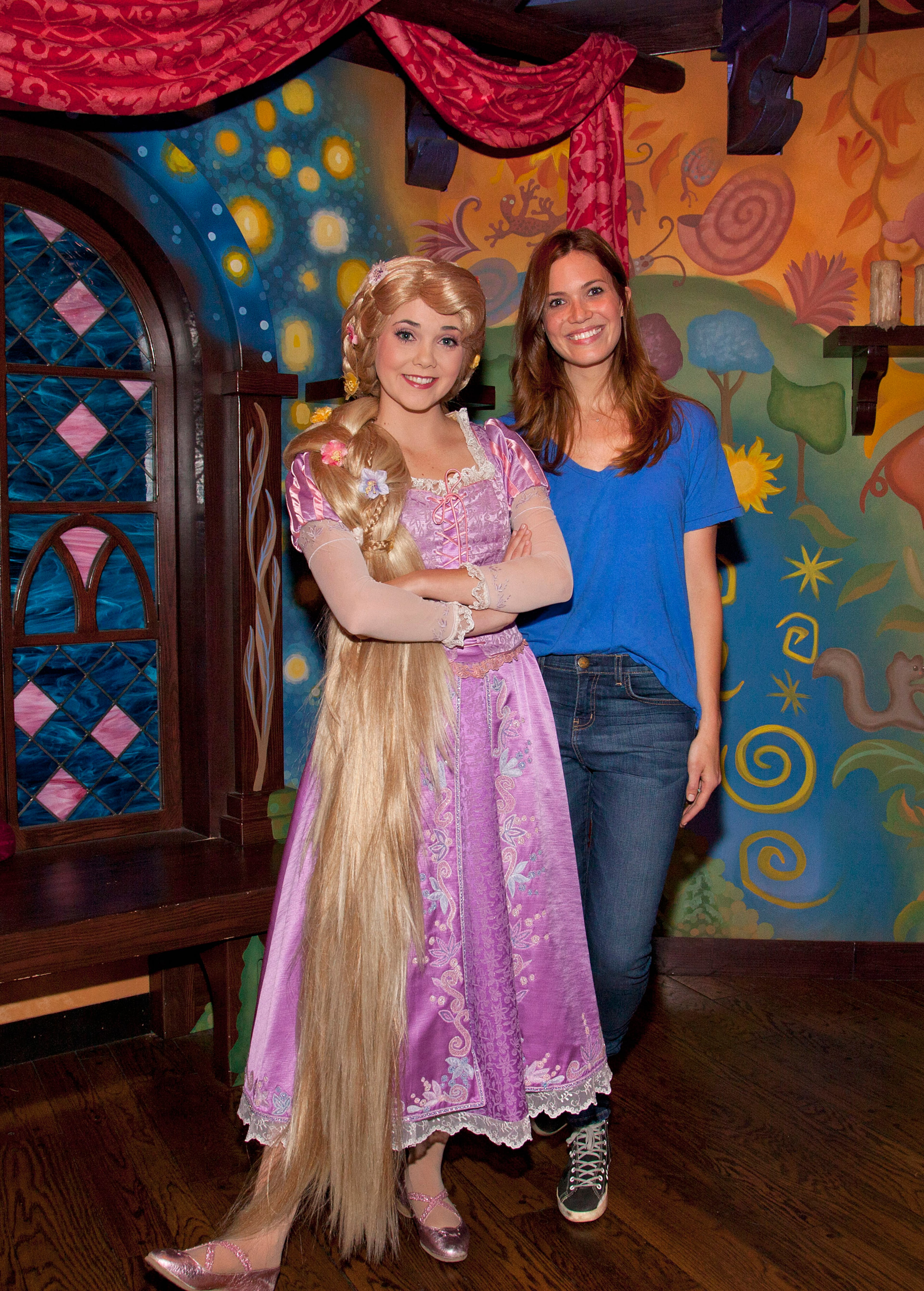 ANAHEIM, CA - OCTOBER 15: In this handout photo provided by Disney Parks, singer/actress Mandy Moore poses with Rapunzel at Disneyland Park October 15, 2012 in Anaheim, California. Moore provided the voice for Rapunzel in Disney's 2010 animated film "Tangled" and in this year short, "Tangled Ever After." (Photo by Paul Hiffmeyer/Disney Parks via Getty Images)