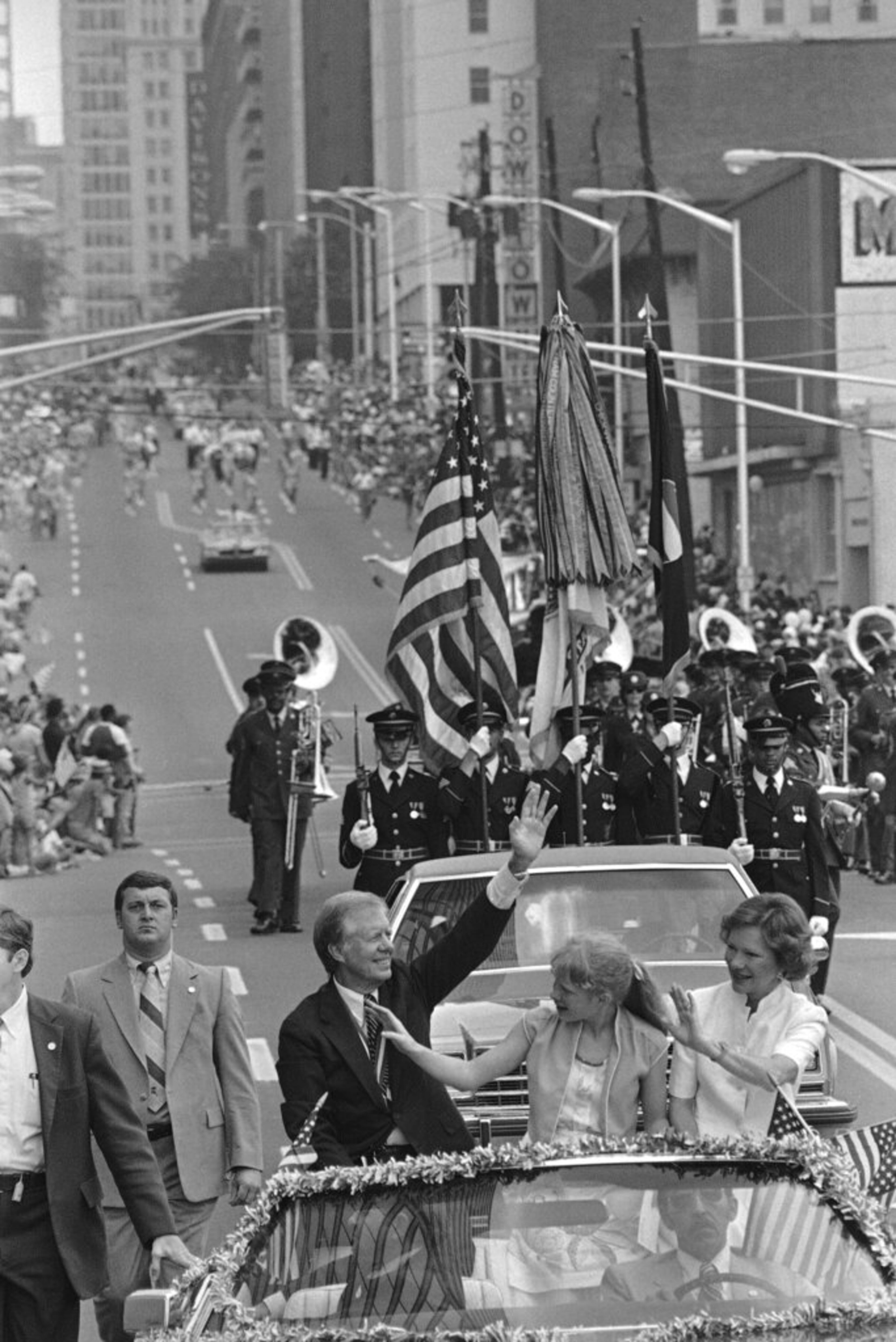 FILE - In this July 4, 1981 file photo, Former President Jimmy Carter his wife Rosalynn Carter, right, and daughter Amy Carter, wave to the crowd along Peachtree Street as they lead a parade through the streets in Atlanta, Ga. Carter was the Grand Marshal in the Independence Day celebration. (AP Photo/Gary Gardiner)
