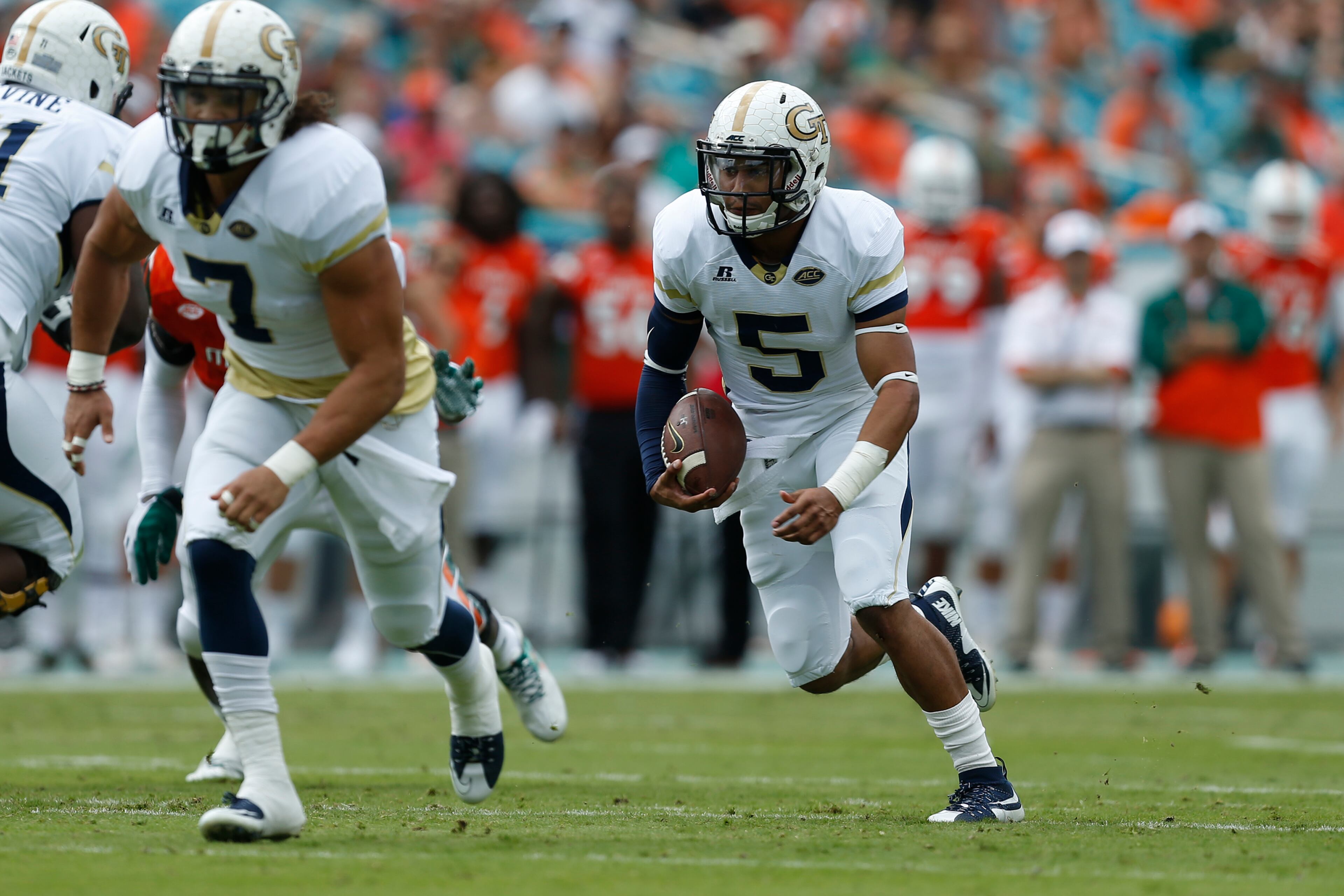 MIAMI GARDENS, FL - NOVEMBER 21: Justin Thomas #5 of the Georgia Tech Yellow Jackets runs with the ball during first quarter action against the Miami Hurricanes on November 21, 2015 at Sun Life Stadium in Miami Gardens, Florida.(Photo by Joel Auerbach/Getty Images)