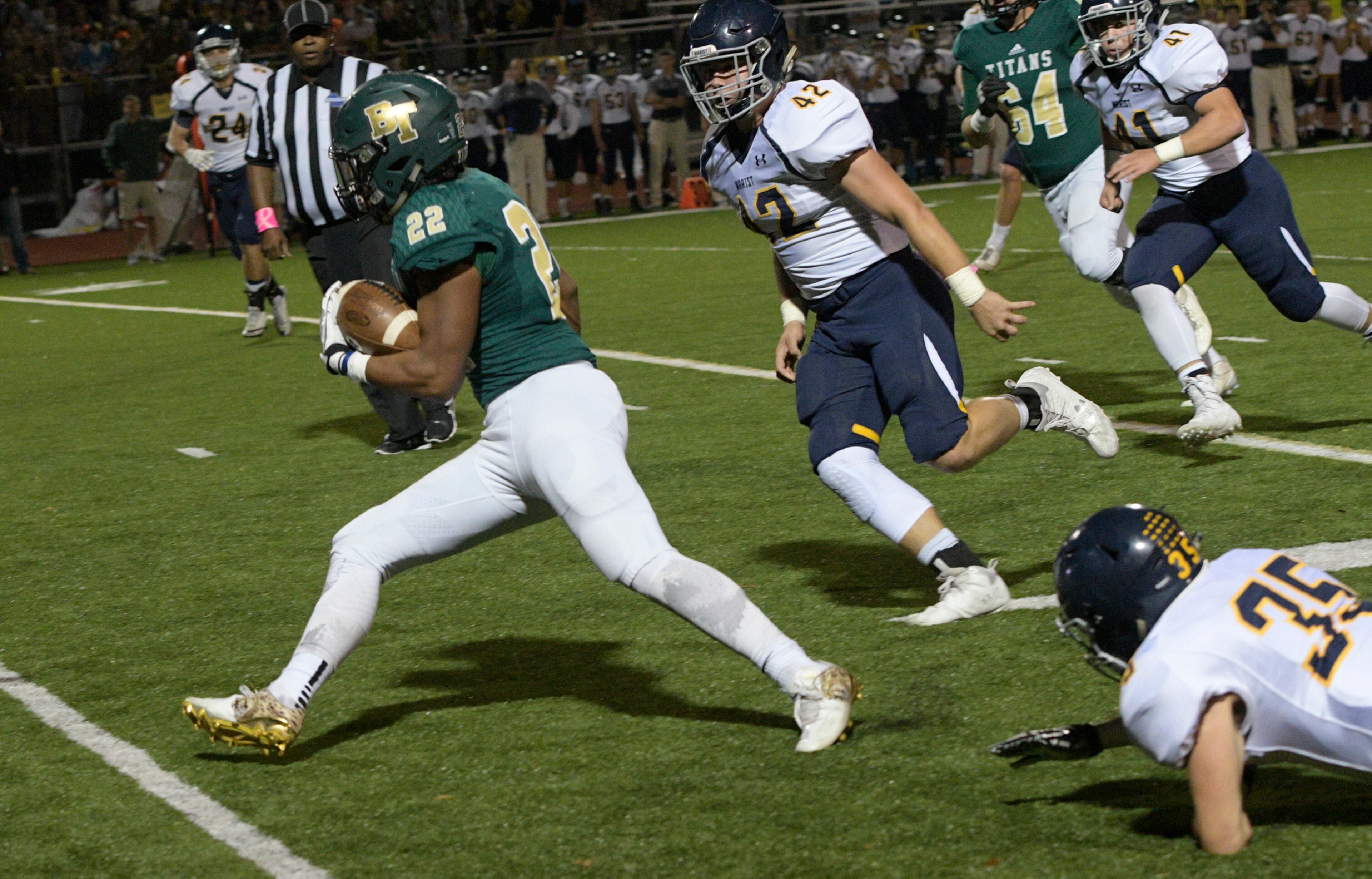 Blessed Trinity RB Steele Chambers (22) runs for a TD as he leaves Marist's Ben Rosing (35) and LB Paul Stanley (42) behind during a high school football game, Friday, Oct. 20, 2017, in Roswell. (John Amis)