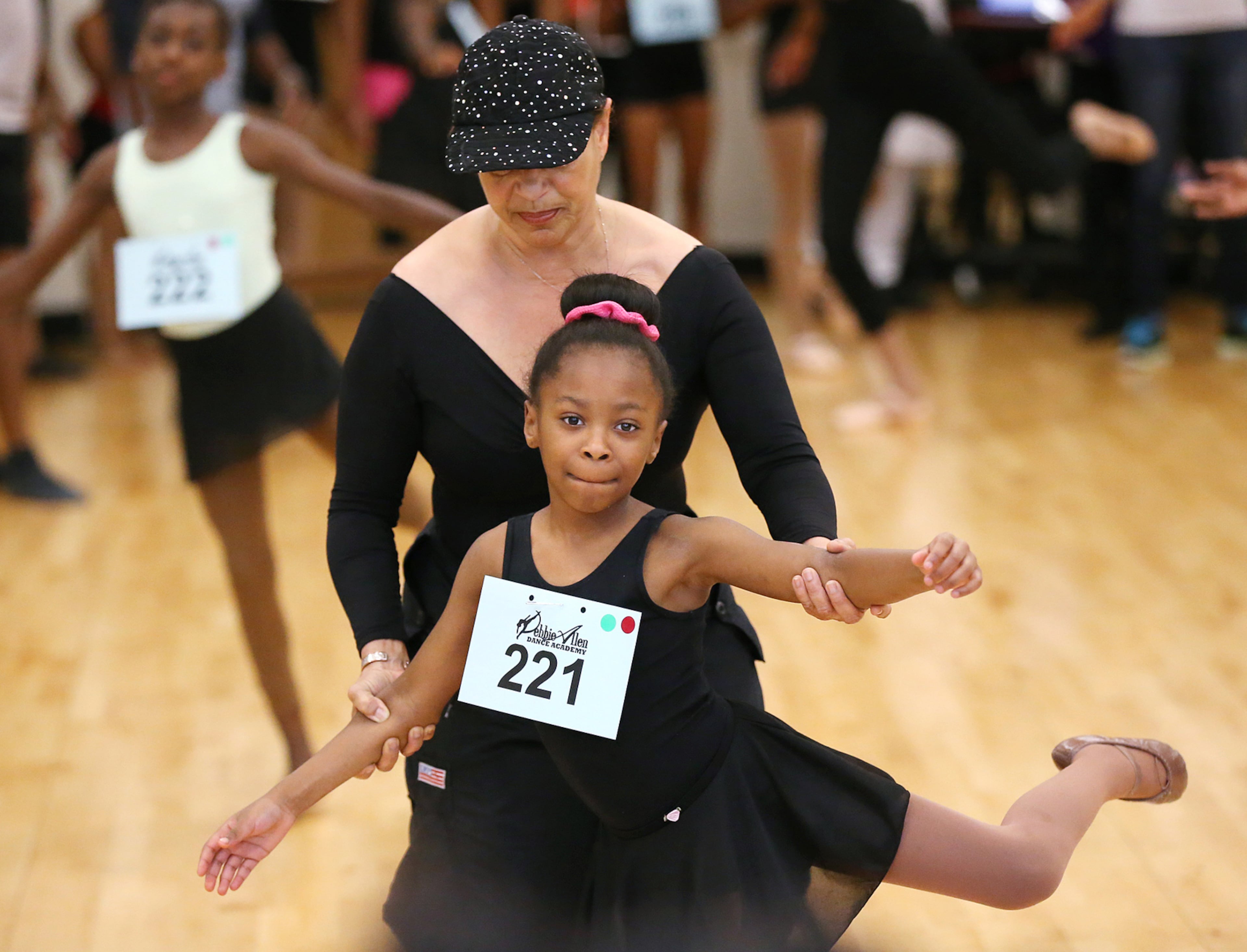 HELP WITH HER MOVES--051516 ATLANTA: Legendary choreographer Debbie Allen helps a young dancer with the proper form during auditions for a master class seeking students for her Debbie Allen Dance Academy Summer Intensive camp in Atlanta at Maynard Jackson High School on Sunday, May 15, 2016, in Atlanta. Curtis Compton / ccompton@ajc.com